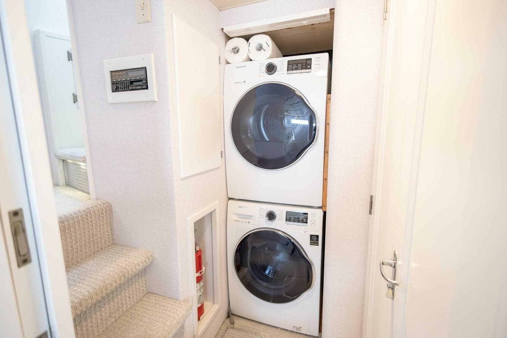 Stacked washer and dryer in 1989 Hatteras Custom Cockpit yacht interior.