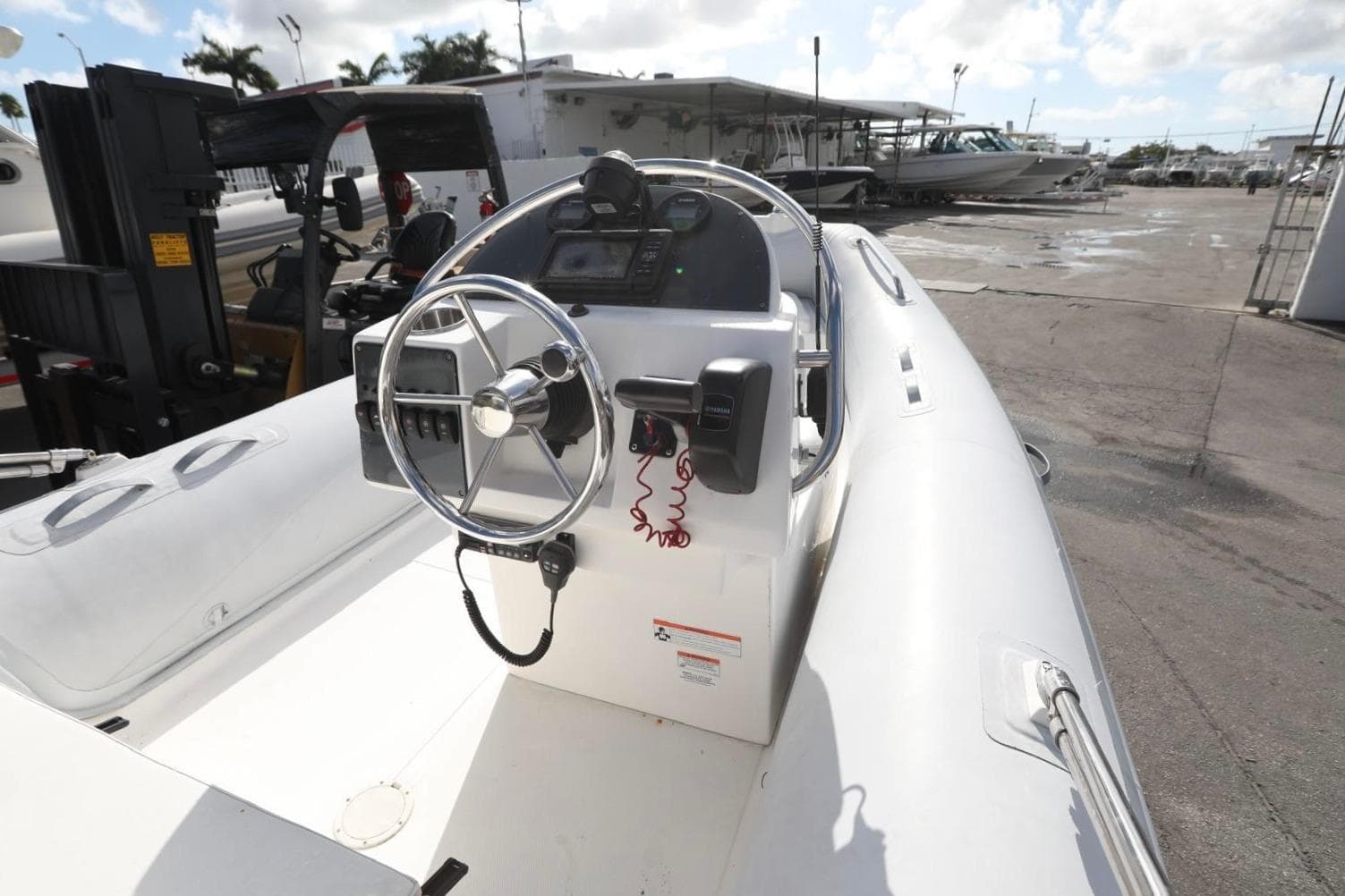 2015 AB Inflatables Oceanus 17 VST boat with steering wheel and control panel.
