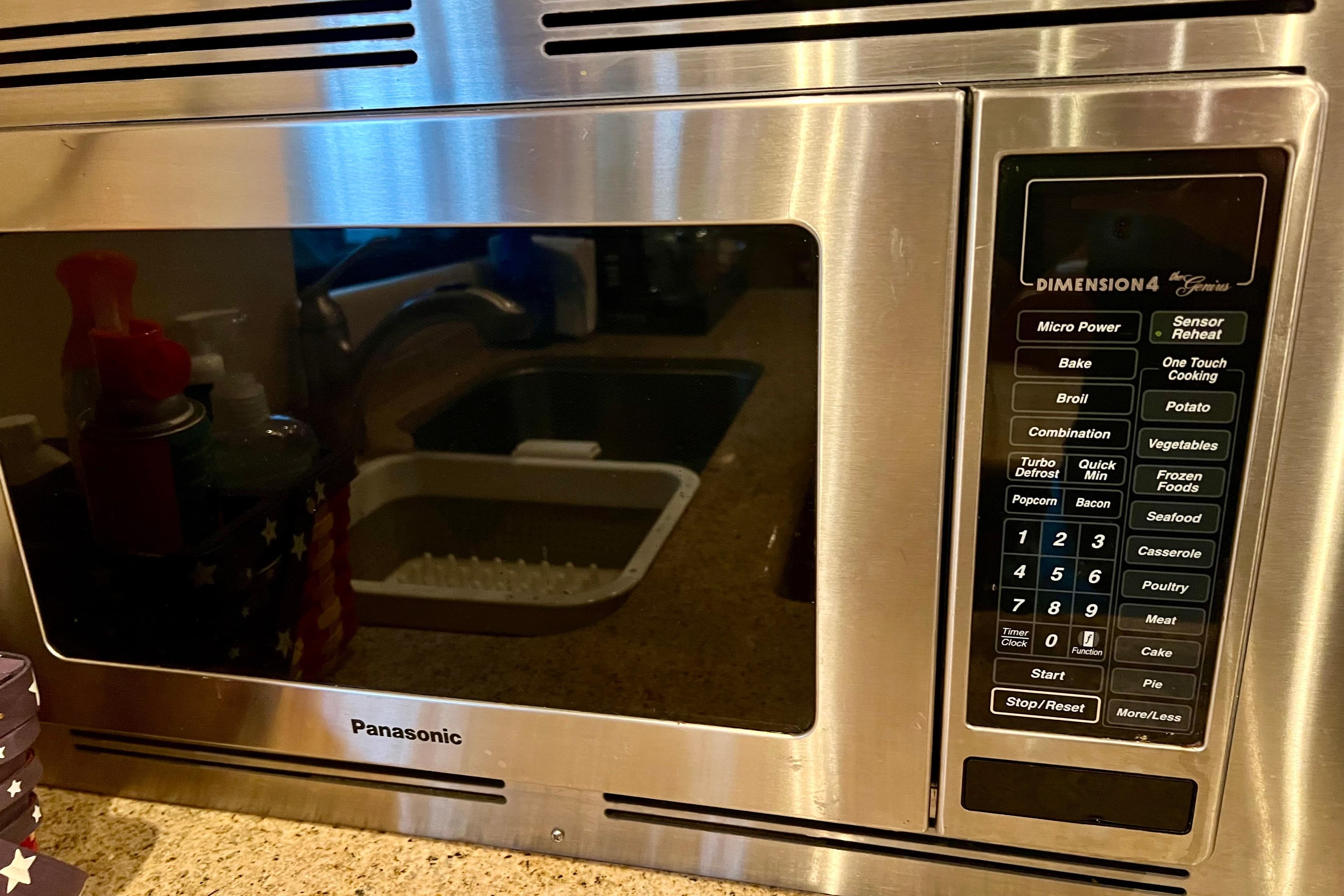 Panasonic Dimension4 microwave with various cooking options, set in a kitchen environment.