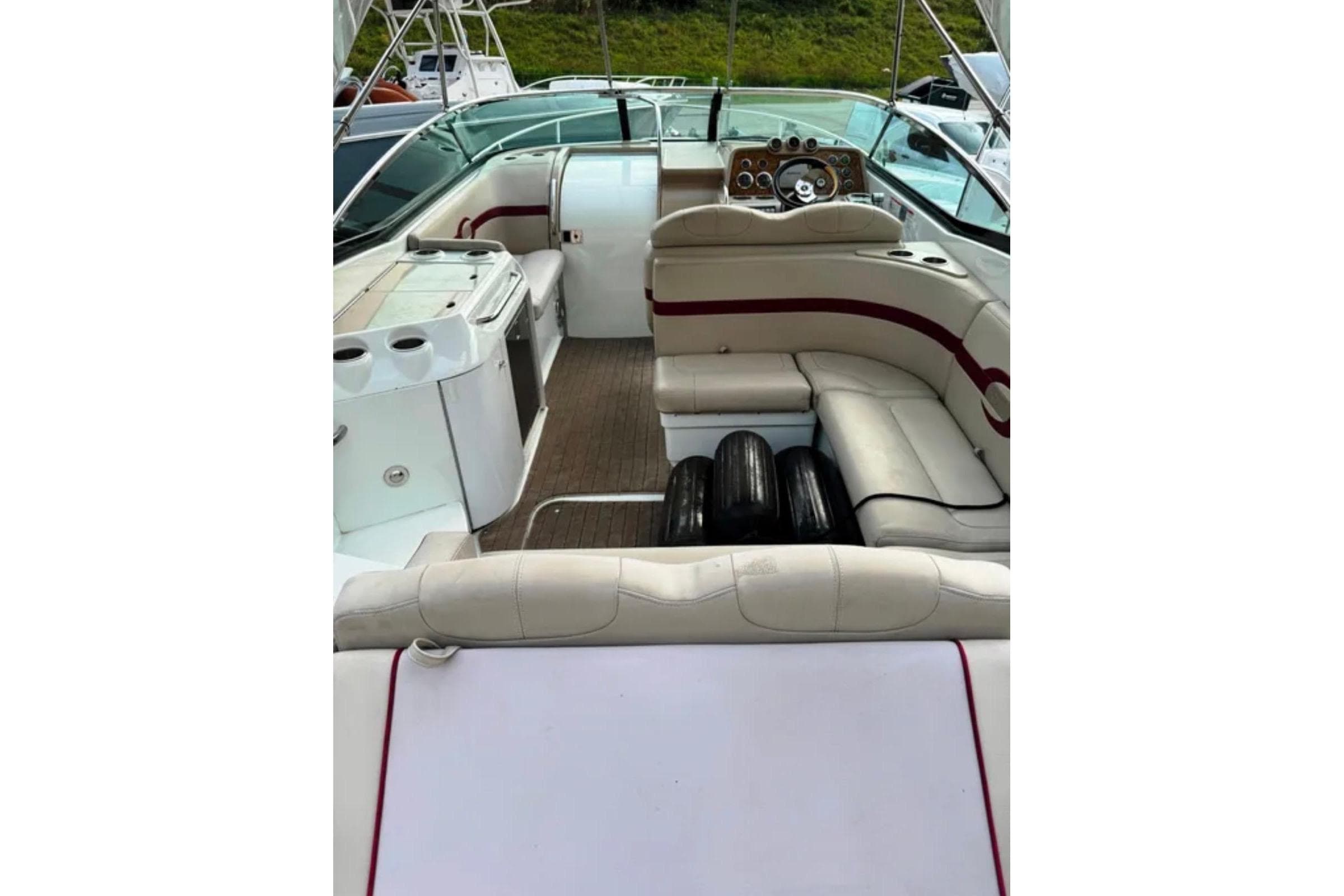 2010 Formula 310 Sun Sport boat interior with seating and dashboard view.