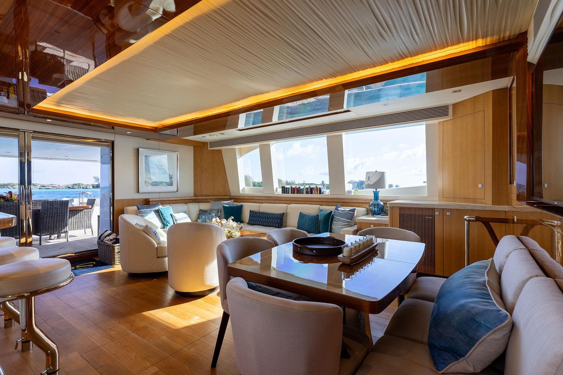 Luxurious Horizon PC74 yacht interior with elegant seating, dining area, and ocean view, 2018 model.
