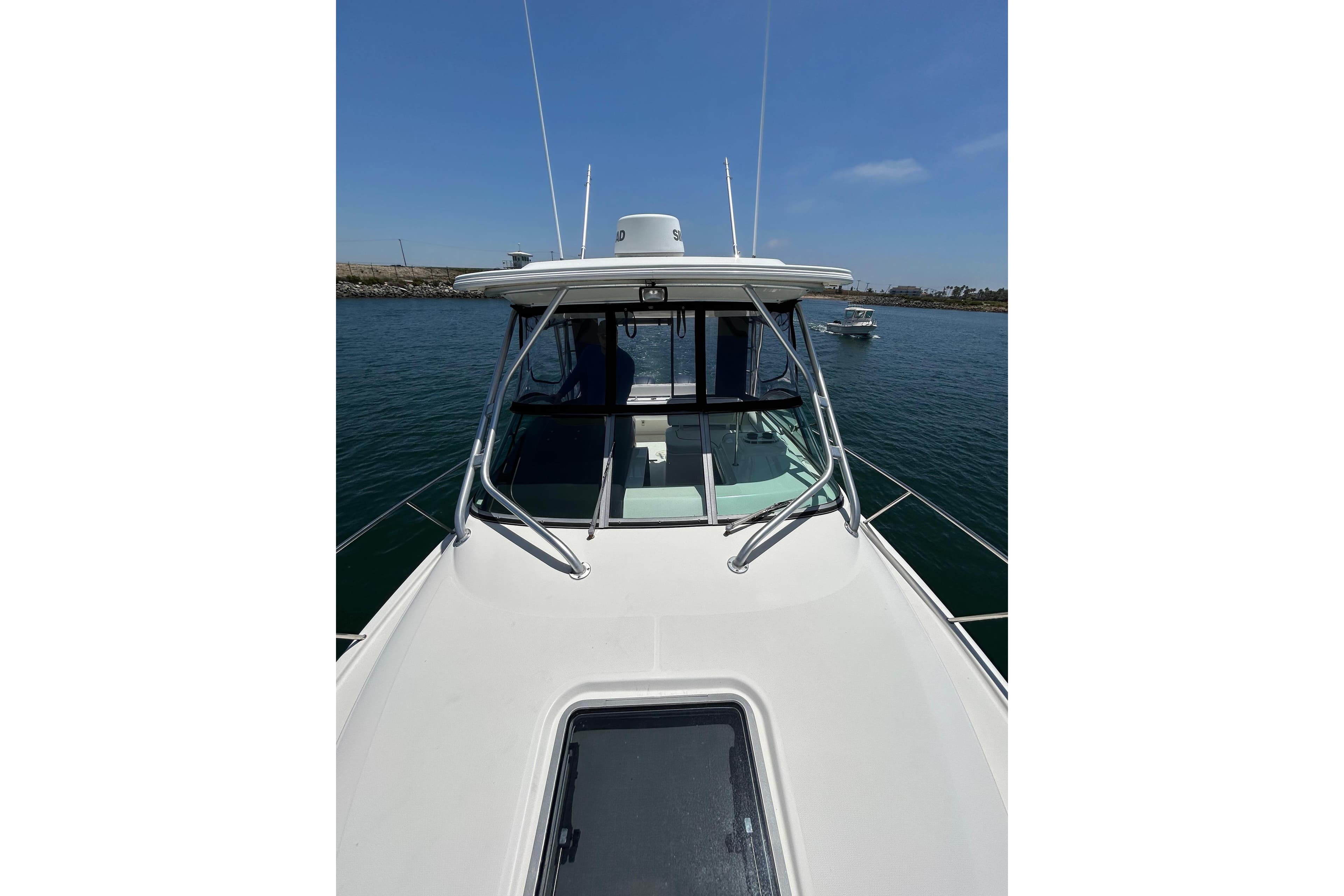 2007 Robalo R305 Walkaround boat on calm water, showcasing sleek design and sturdy build.