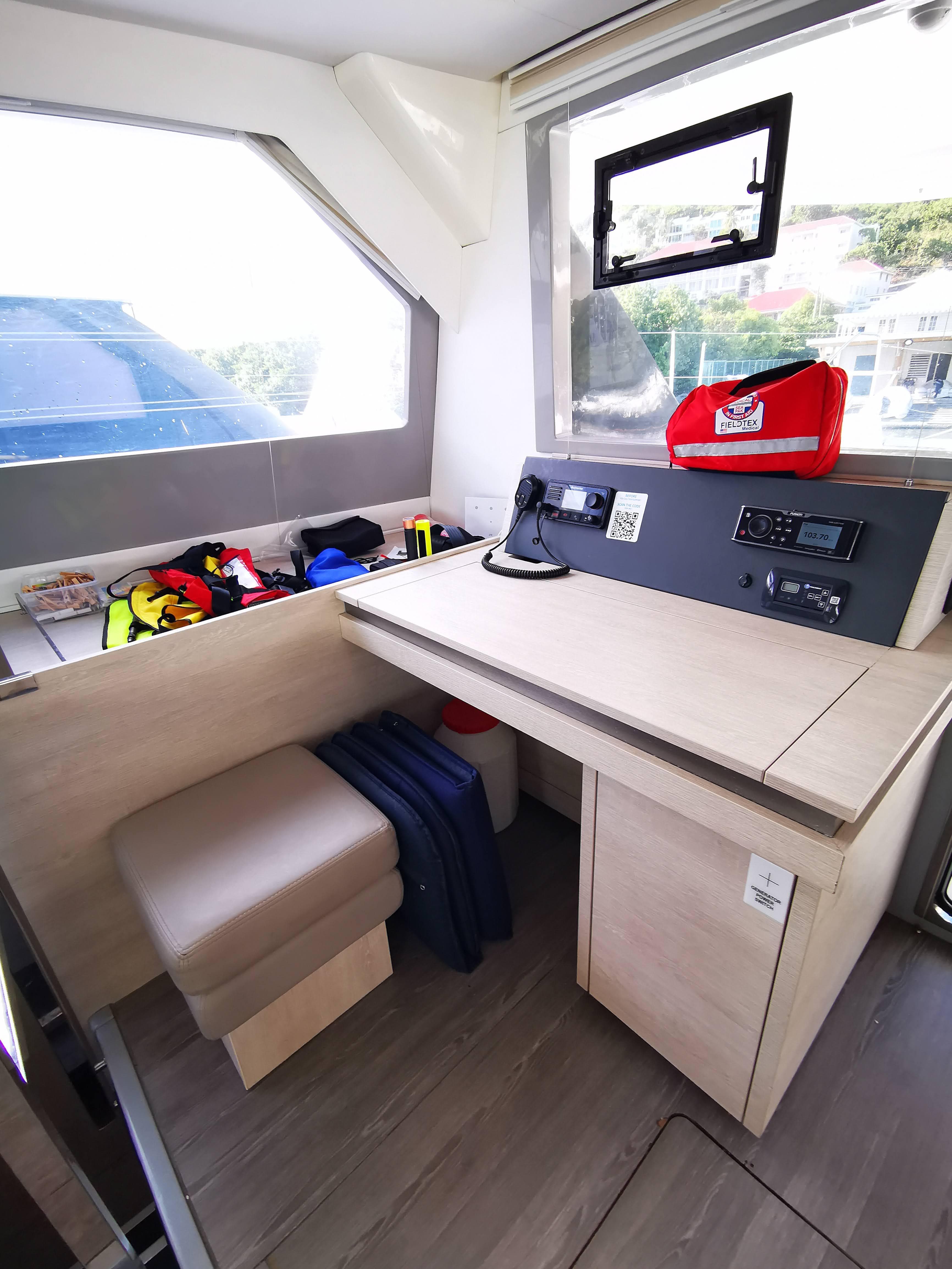 Interior of 2021 Leopard 50 yacht with navigation station and seating area.