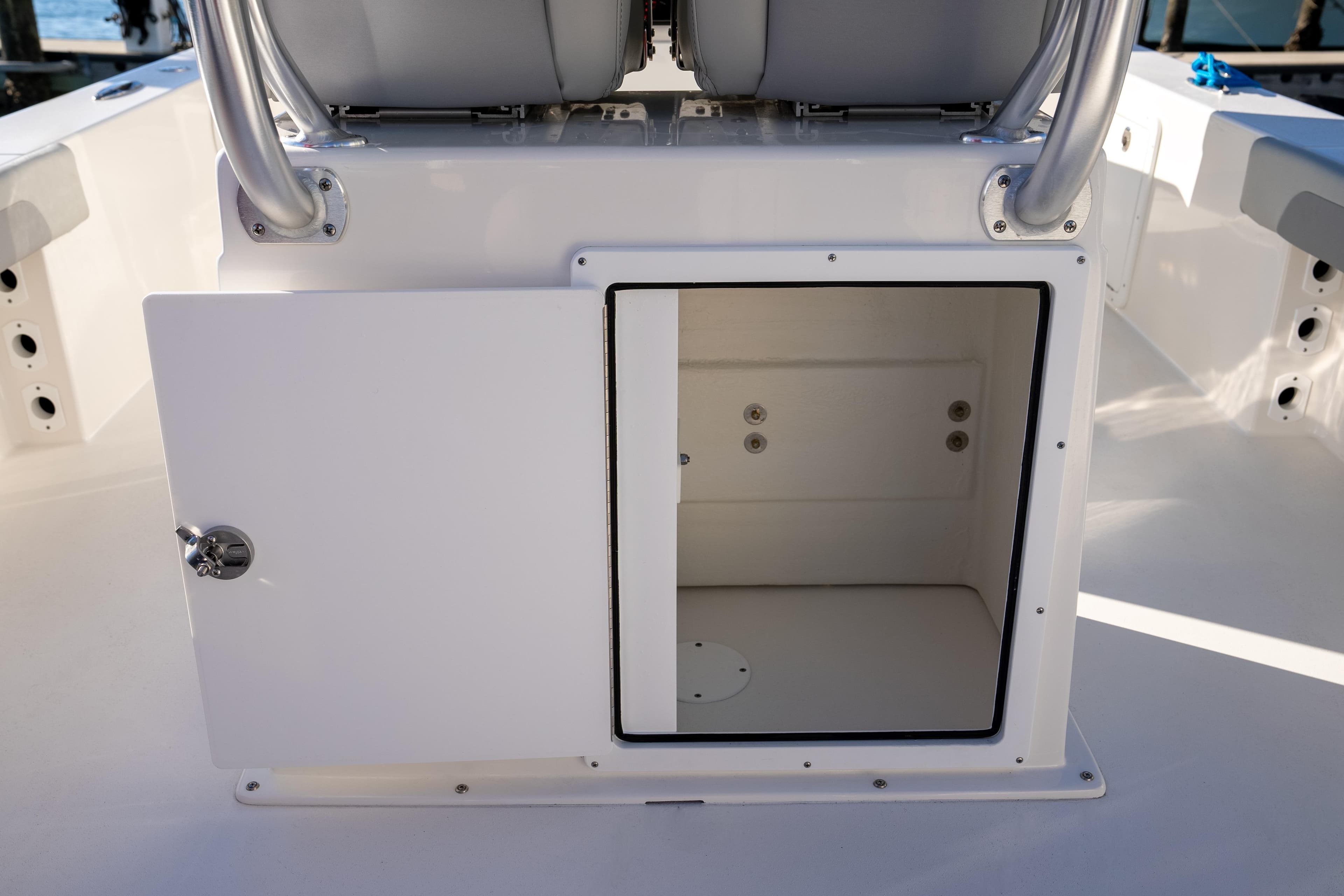 Open storage compartment on 2026 Bay Rider 269 Bay boat, showcasing interior space.