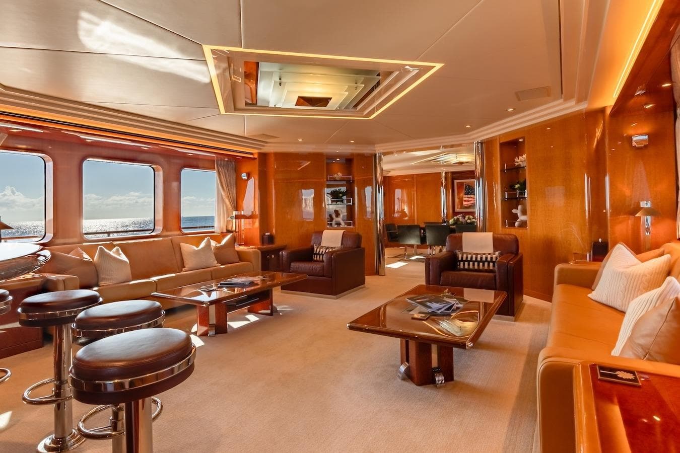 Luxurious interior of 2001 Feadship Custom yacht with elegant seating and ocean views.