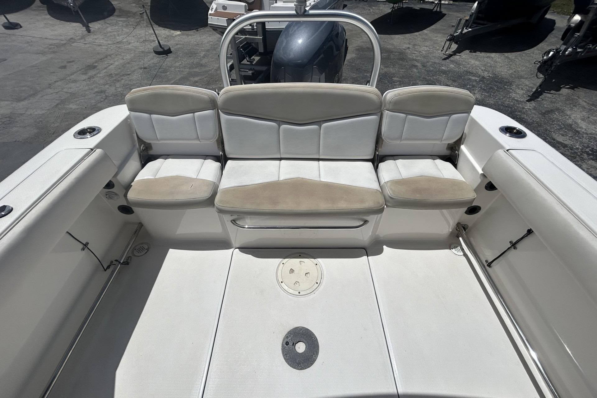 2014 Robalo R207 Dual Console boat interior with cushioned seating and storage.