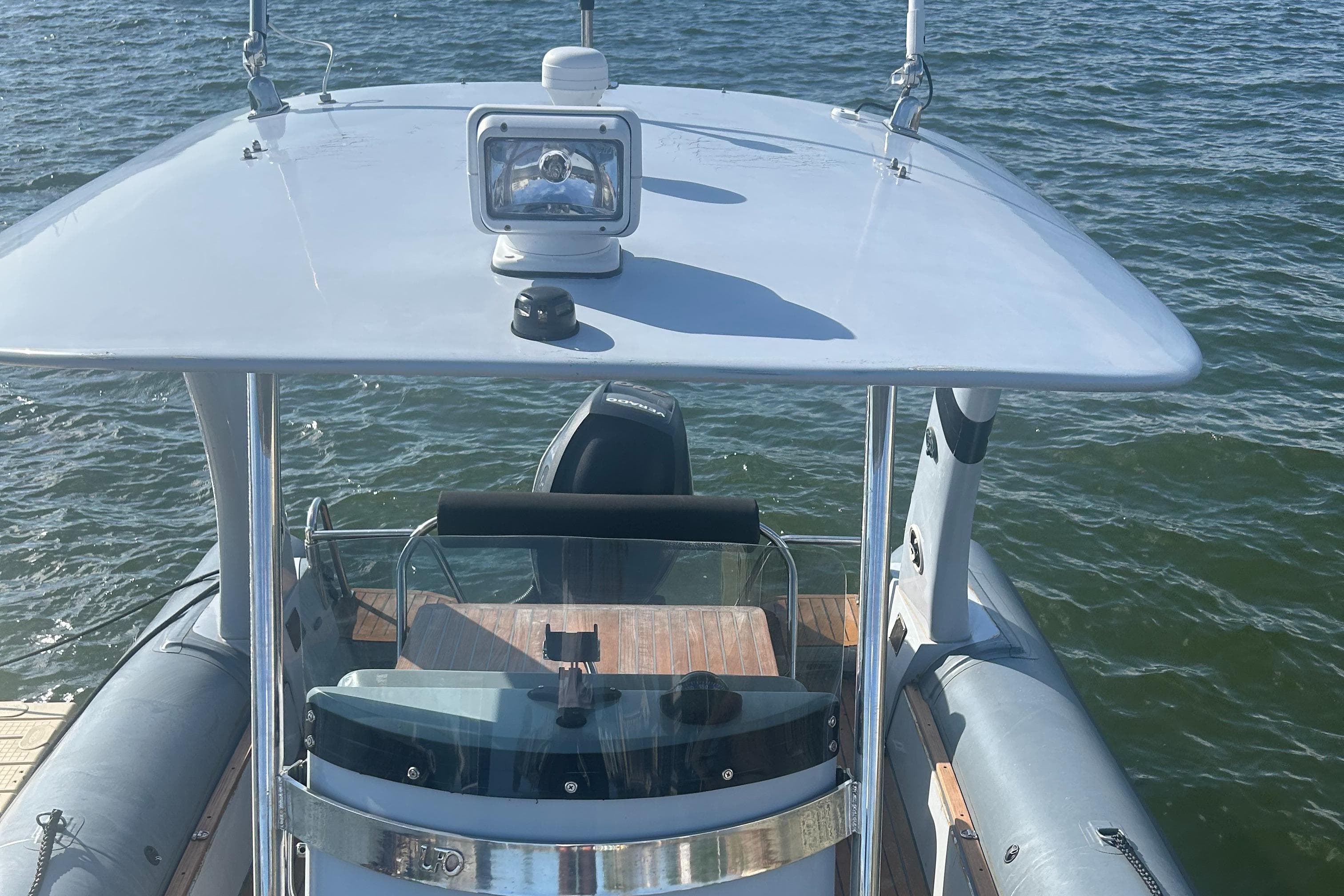 2008 RIB U-23 Carbon Hull boat on water, featuring a sleek design and modern equipment.