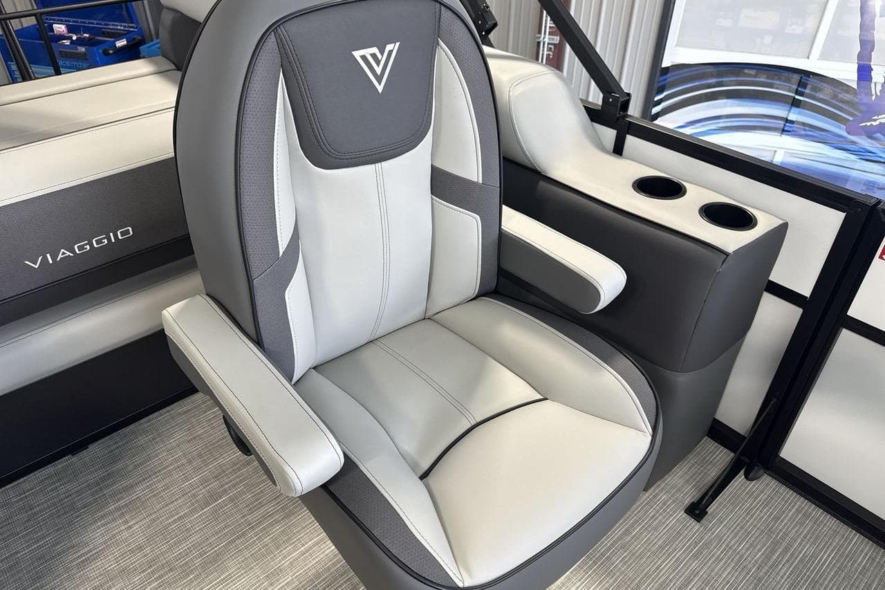 Luxury seating in 2026 Viaggio V20S boat with cup holders and sleek design.