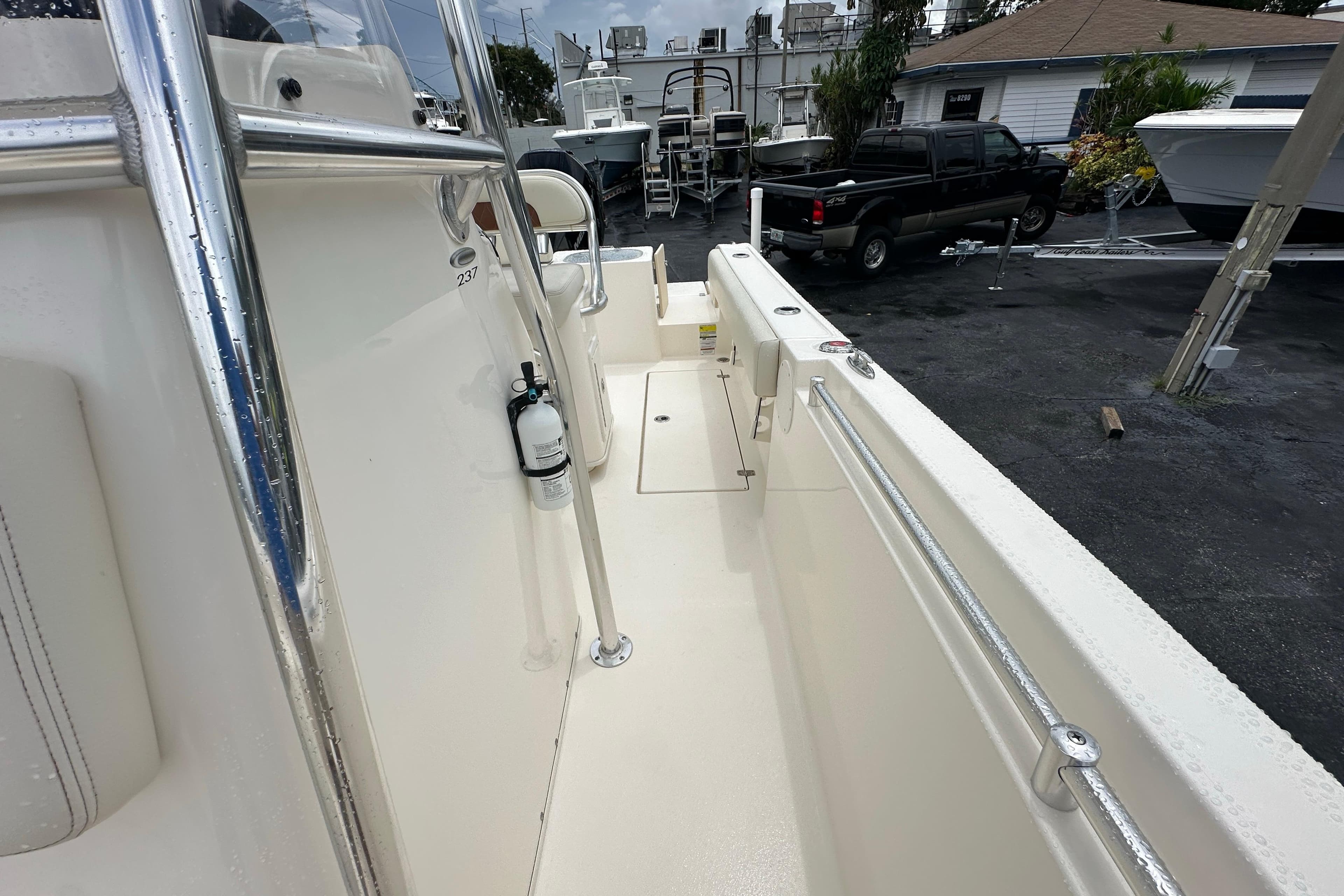 2022 Cobia 237 Center Console boat interior with safety equipment and sleek design.