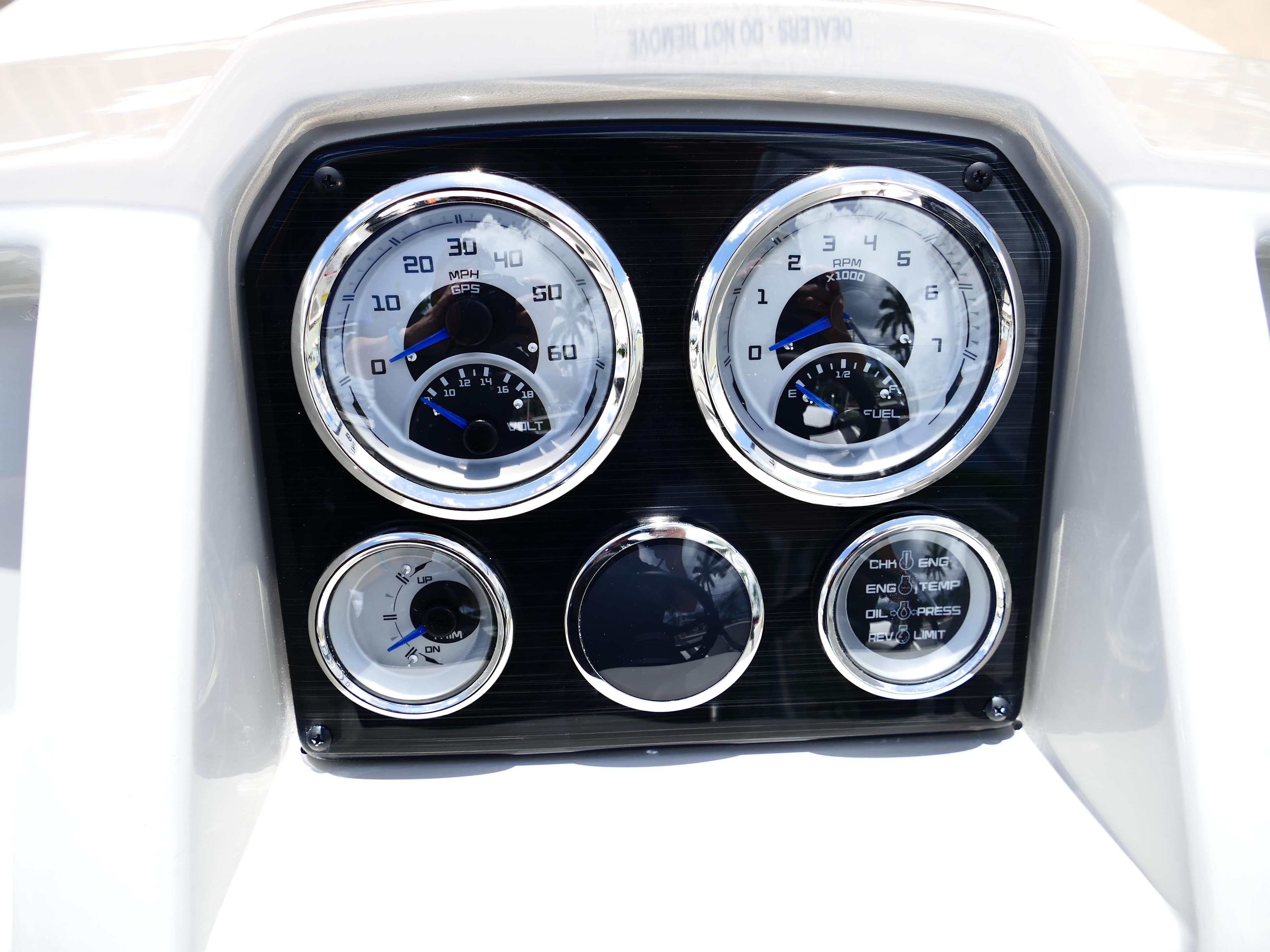 Dashboard of 2026 Starcraft SVX 231 OB DH boat with gauges and controls.