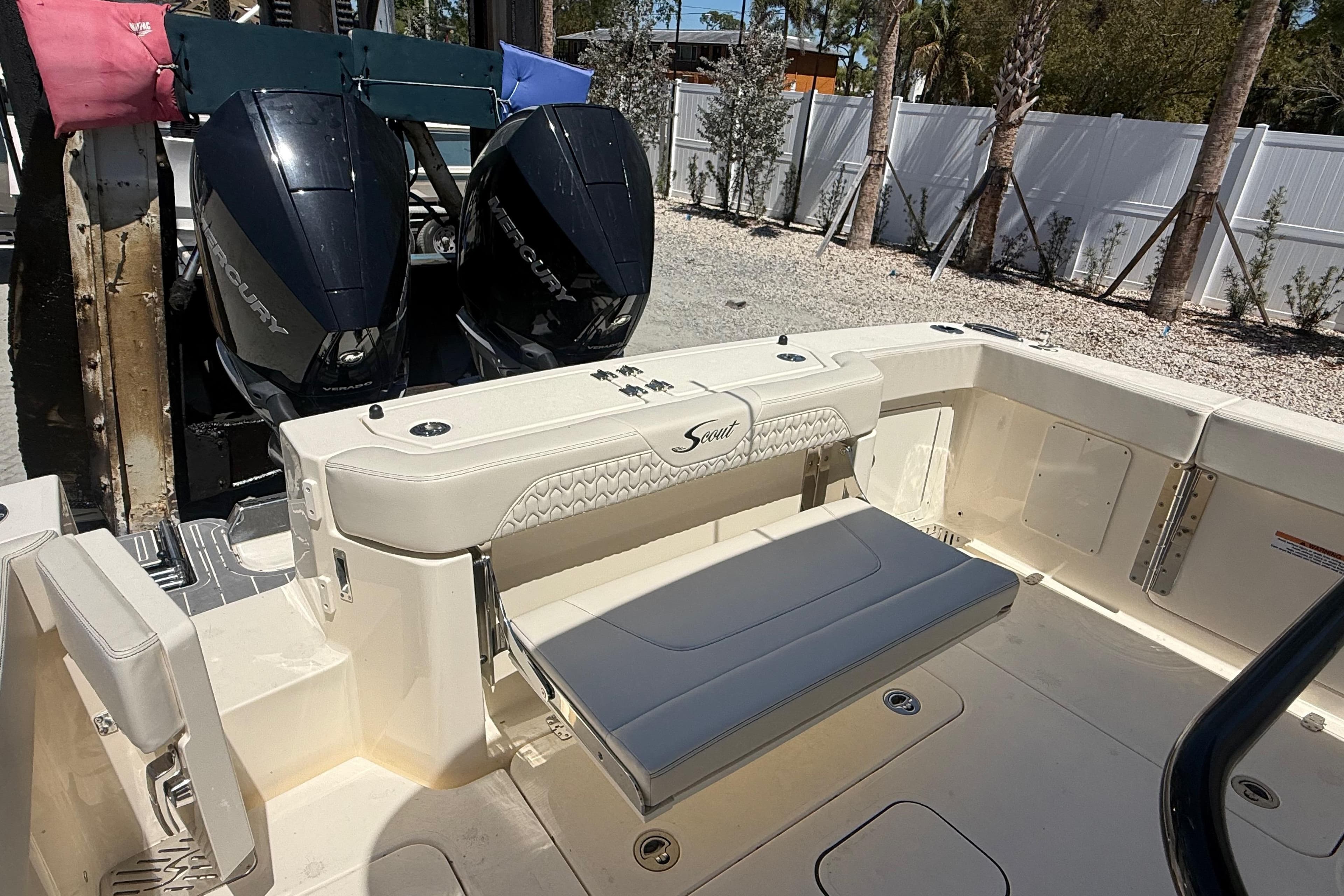 2026 Scout 288 LXF boat with dual Mercury engines and foldable seating.