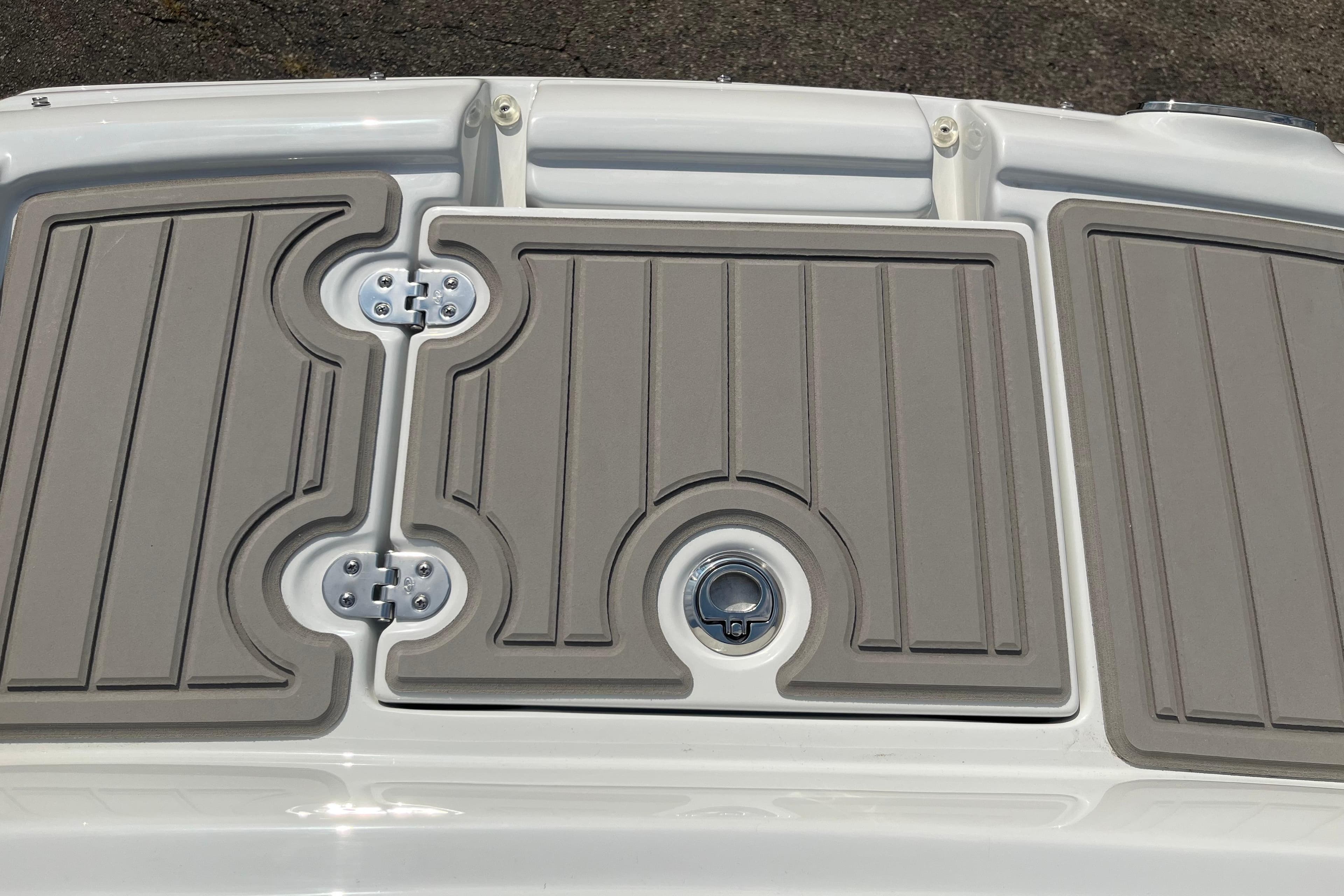2025 Crownline Eclipse E235 boat deck with textured panels and latch.