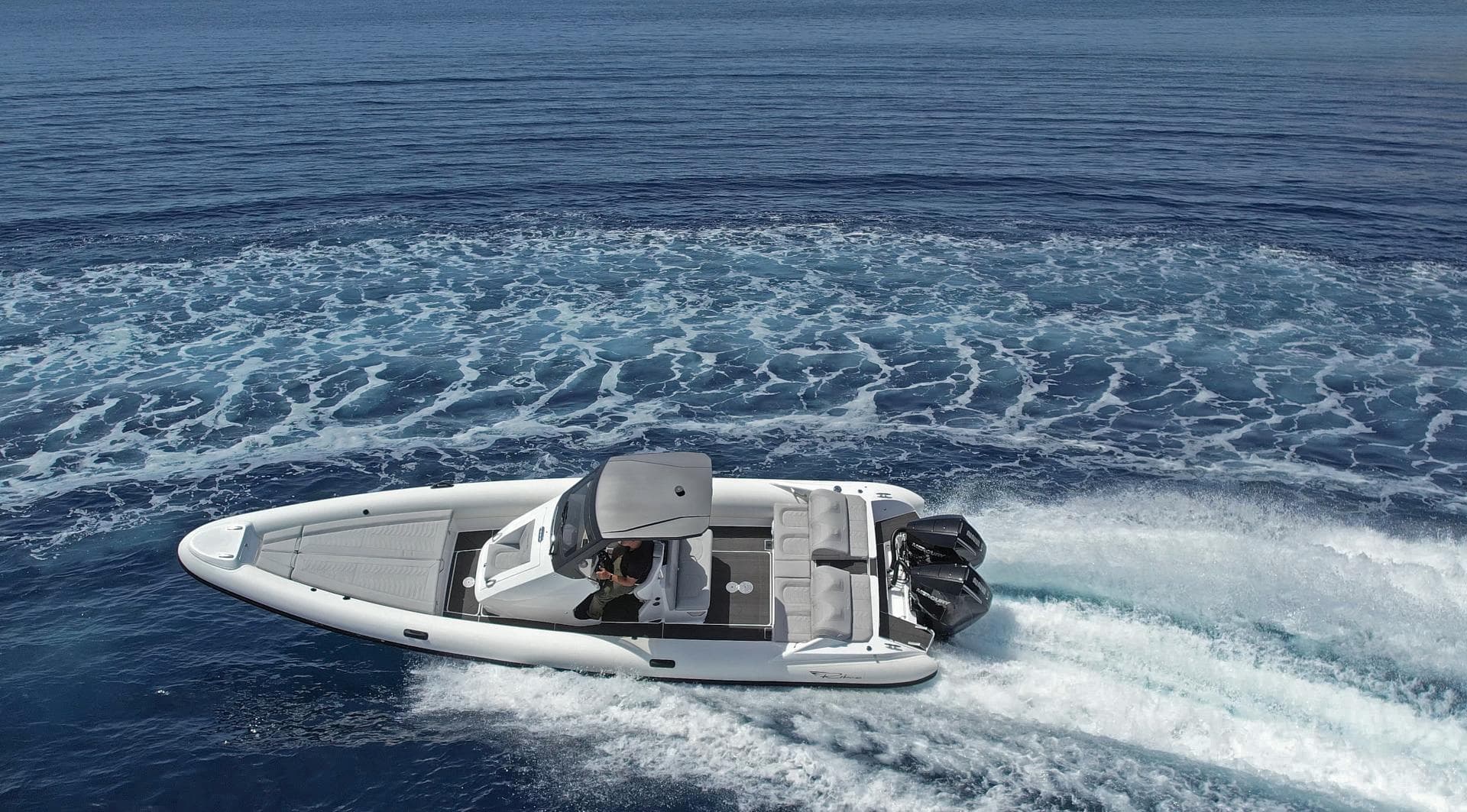 2025 Ribco Venom 30 speedboat cruising on open water, leaving a trail of waves.