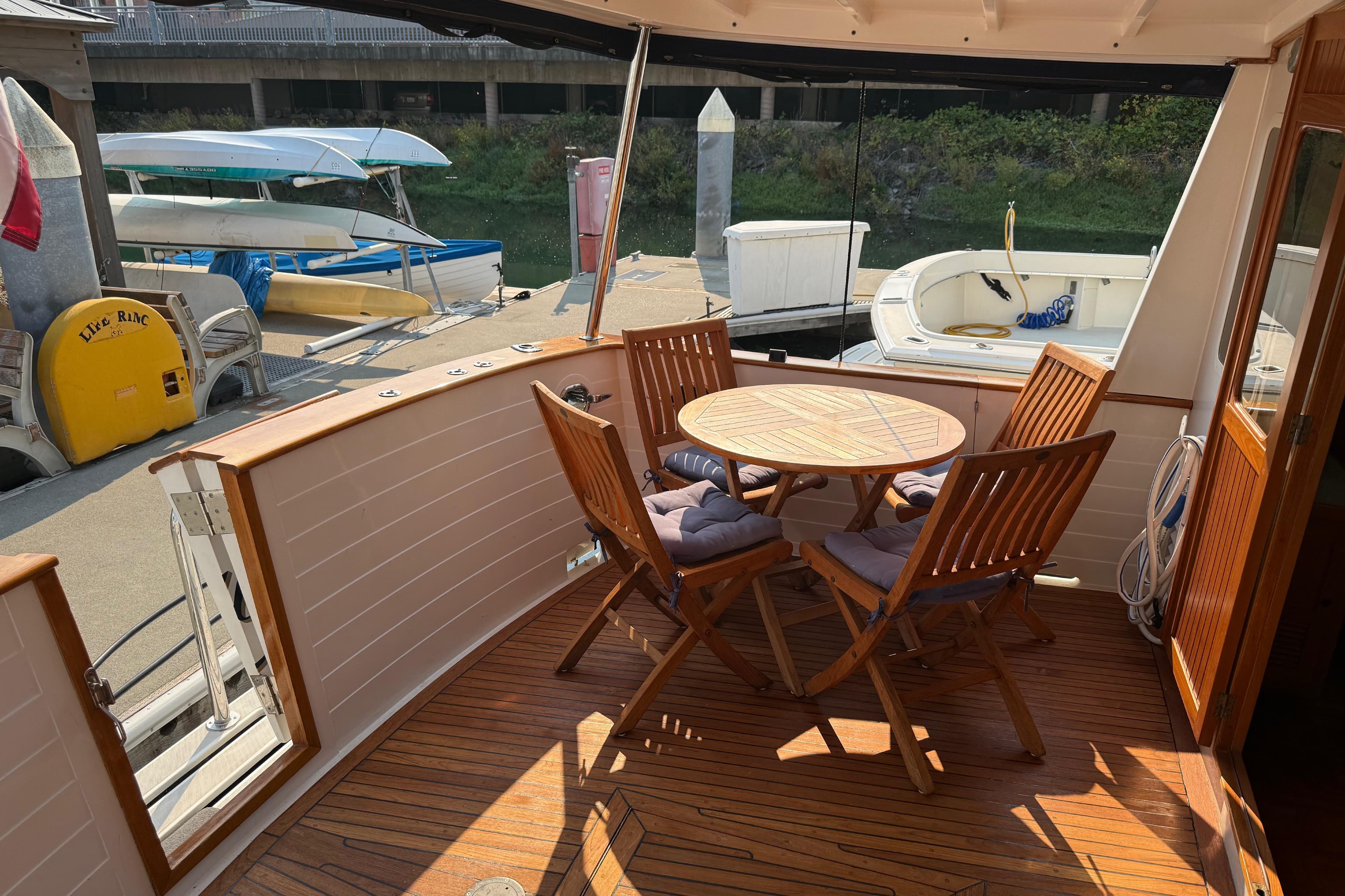 1998 Kadey-Krogen 48' Northsea Widebody Pilothouse with outdoor seating on deck.