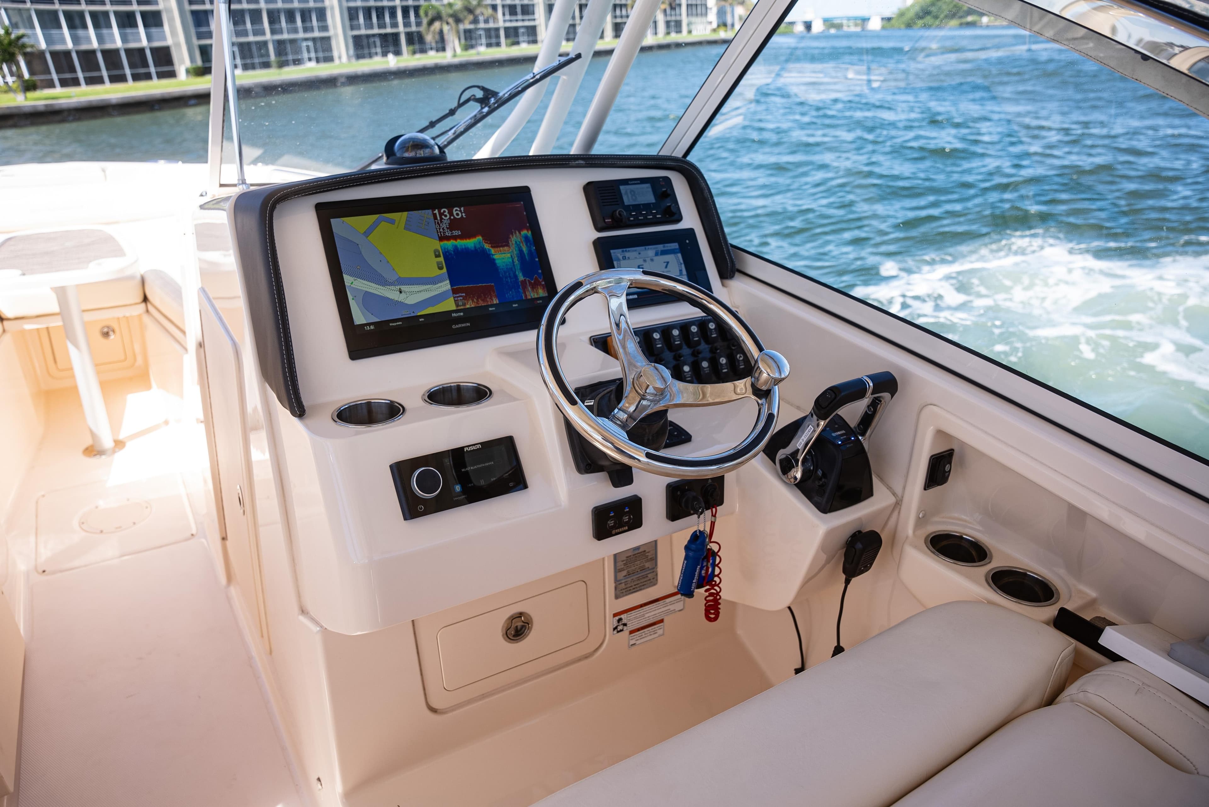 2020 Grady-White Freedom 285 boat dashboard with navigation system and steering wheel.