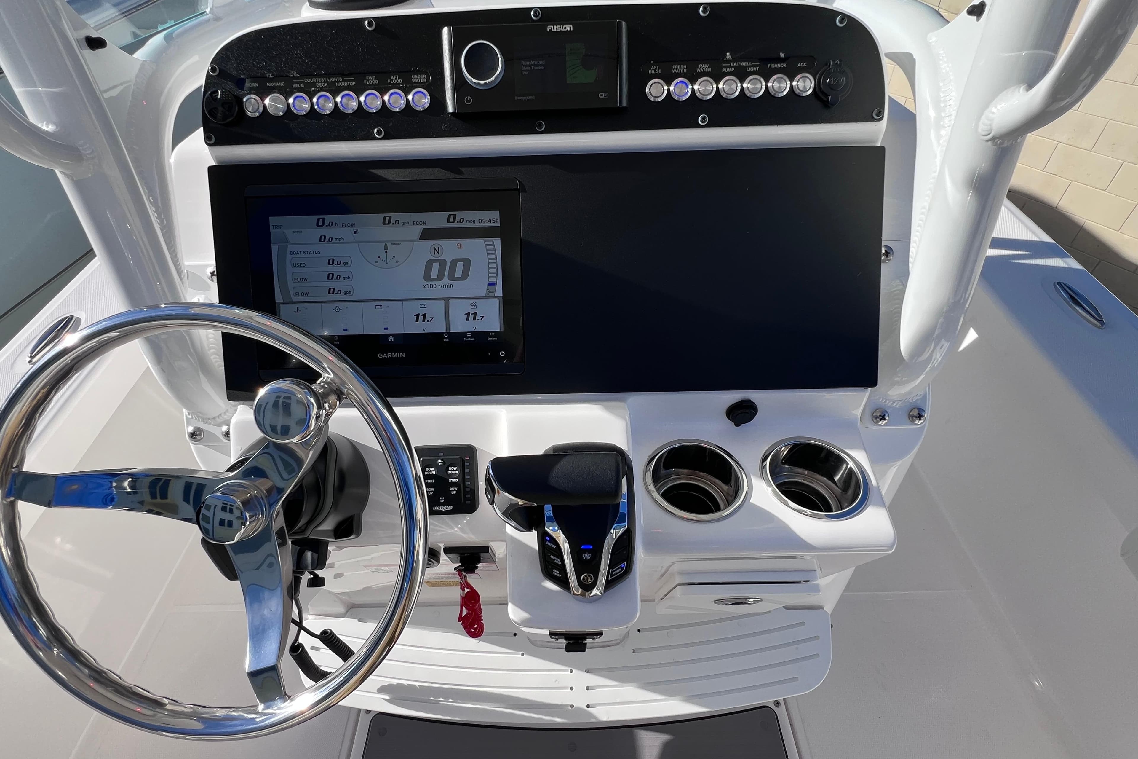 2024 Everglades 243 Center Console dashboard with steering wheel and navigation display.