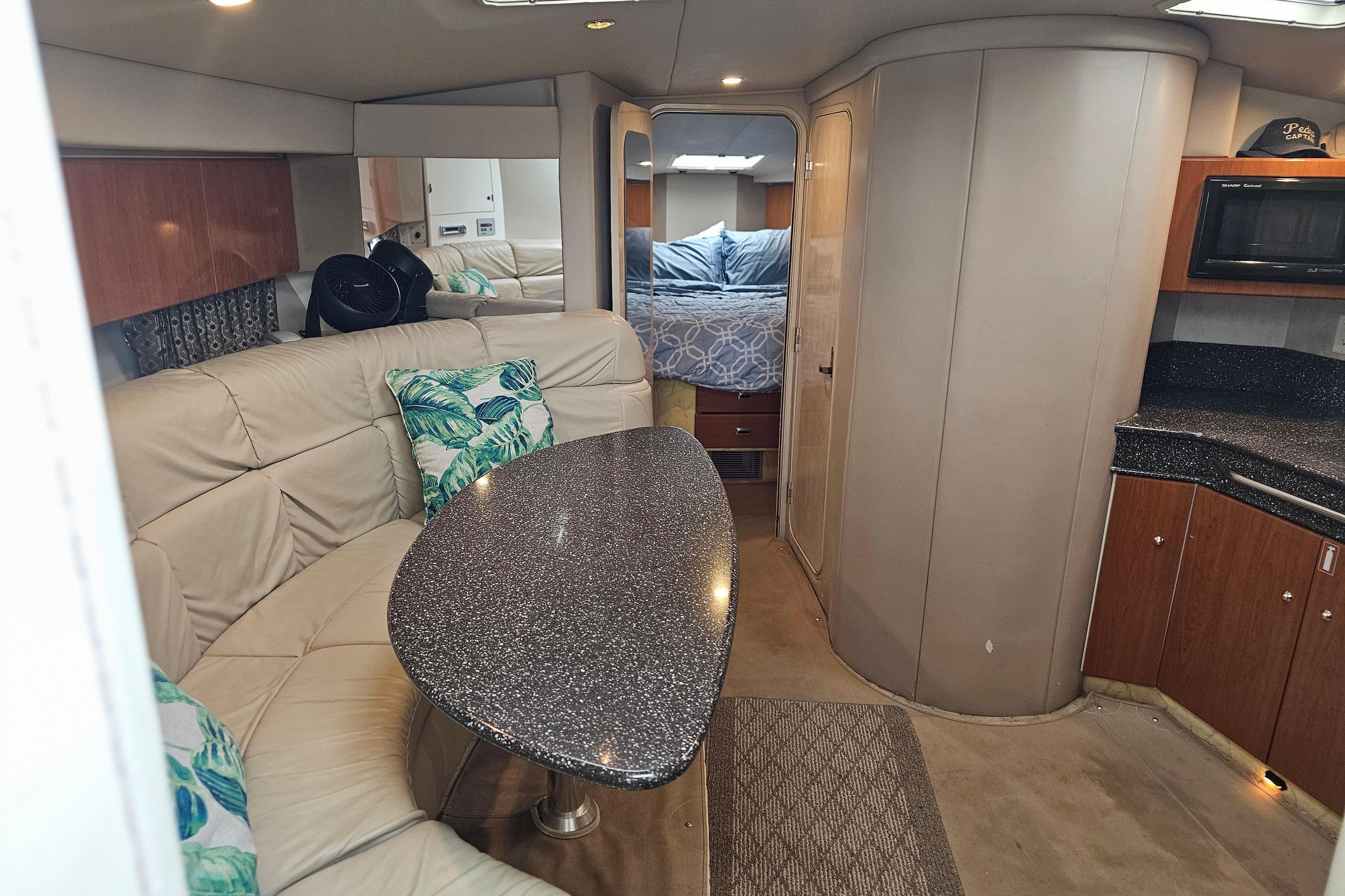 Interior of 2003 Formula 41 Performance Cruiser with cozy seating and modern amenities.