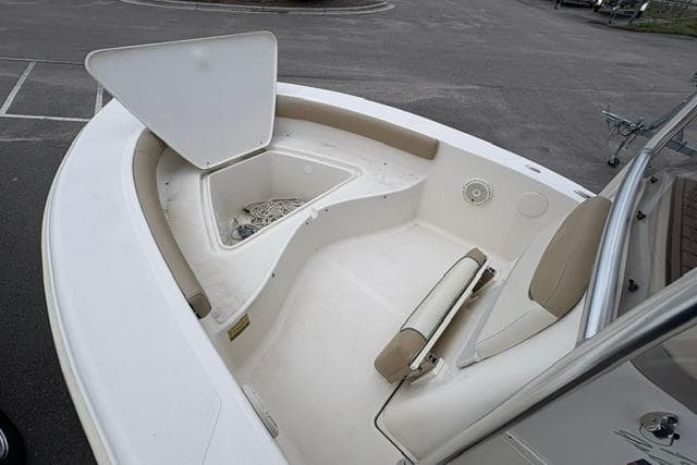 2020 Pioneer 180 Islander boat interior with open storage compartment and seating.