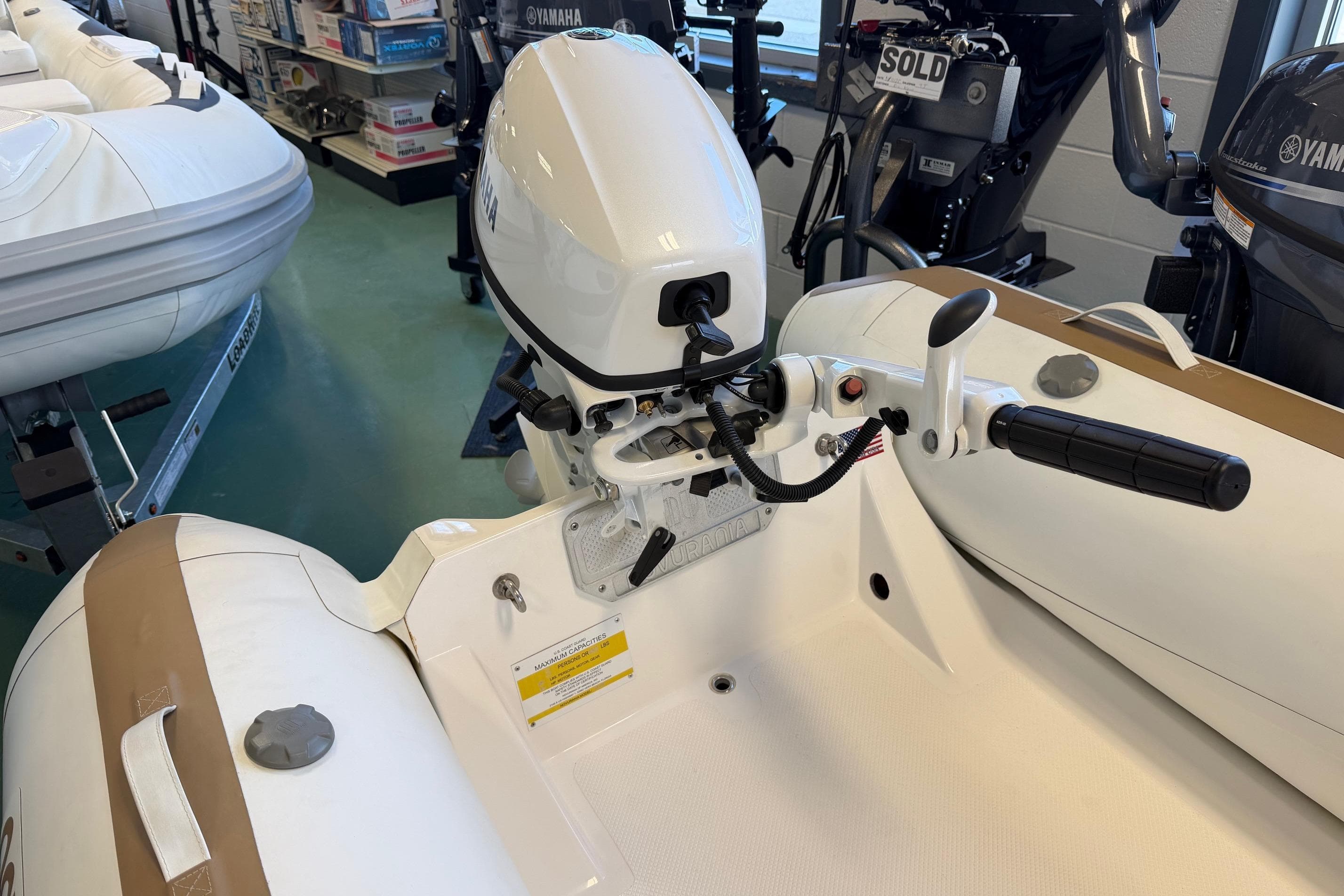 Novurania TR 270 boat with Yamaha outboard motor, displayed in a showroom, 2025 model.