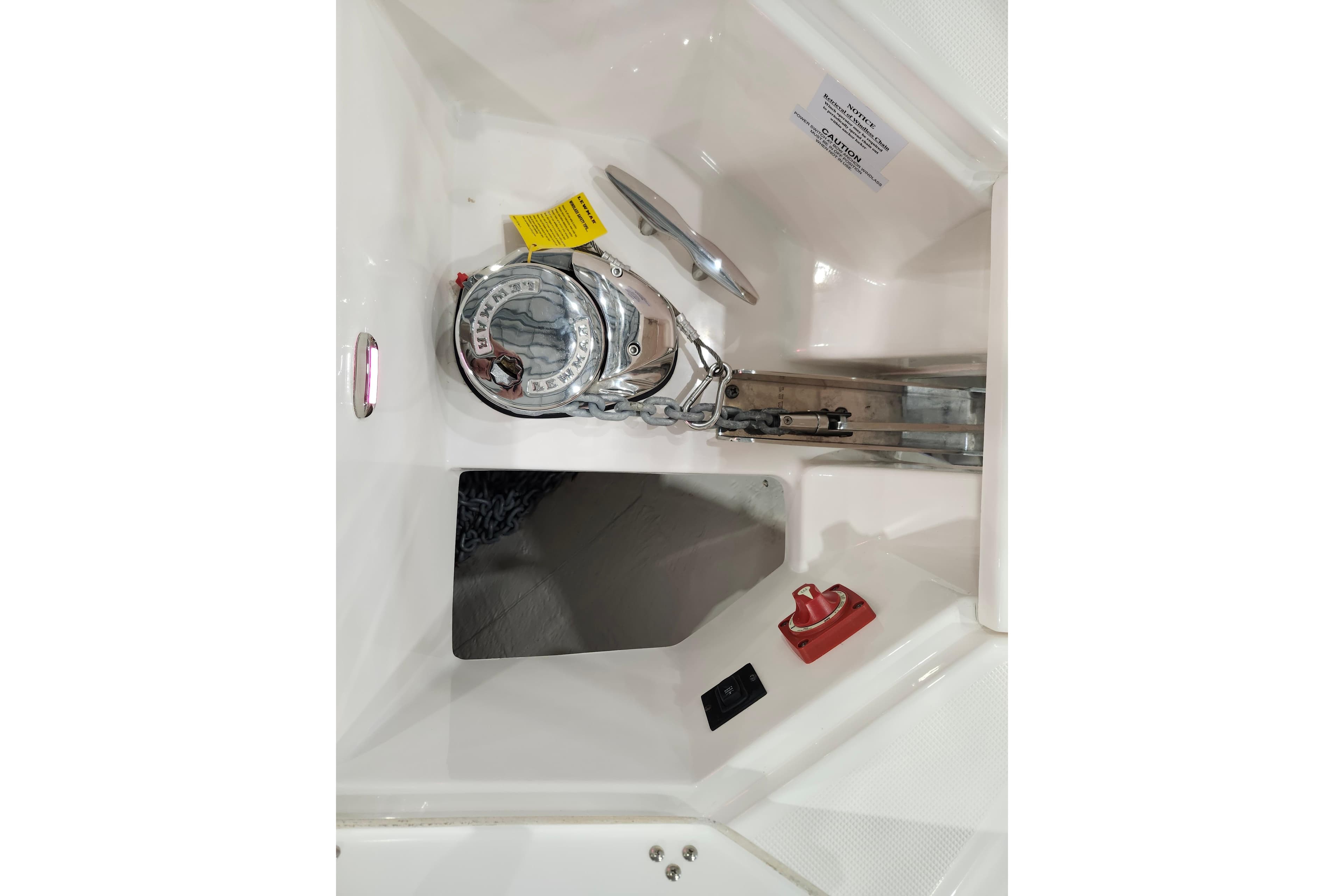 2025 Regal 36 XO boat anchor compartment with winch and control panel.