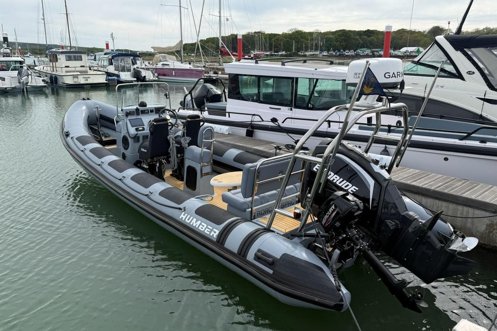 2021 Humber Ocean Pro 8 boat docked in a marina, featuring modern design and equipment.