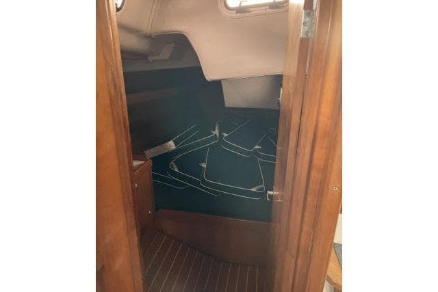 Interior cabin view of 2004 J Boats J/133 sailboat with wooden finish.