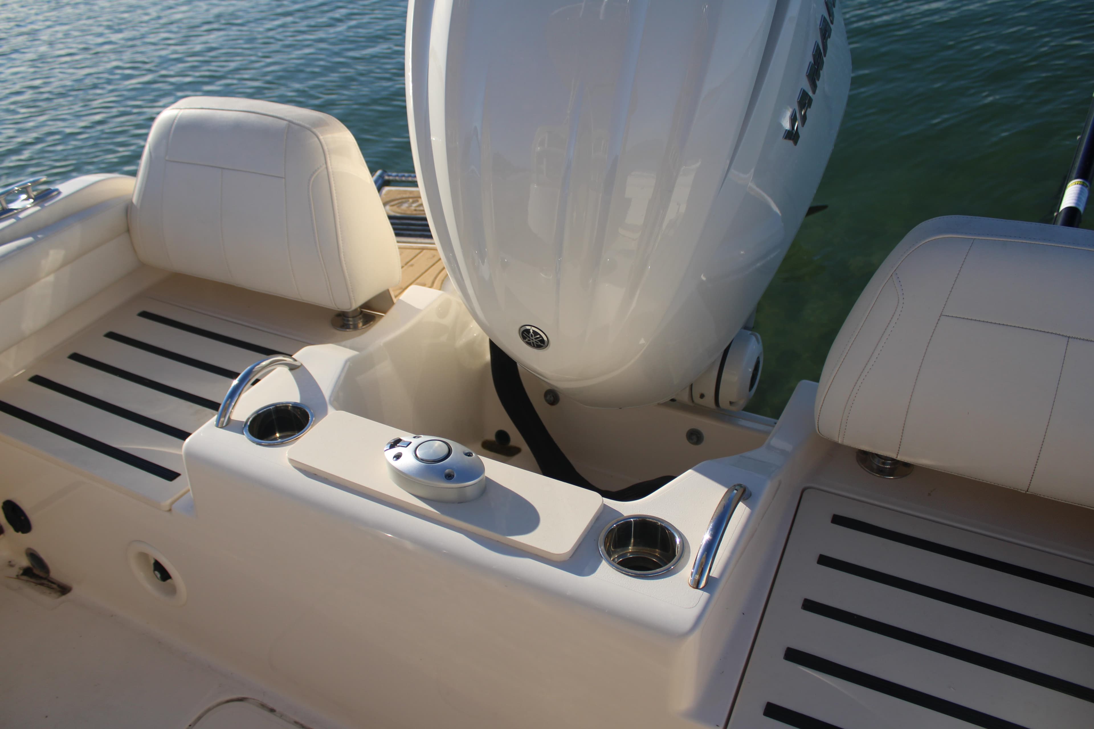2024 Grady-White Fisherman 216 boat interior with Yamaha engine, featuring seating and cup holders.