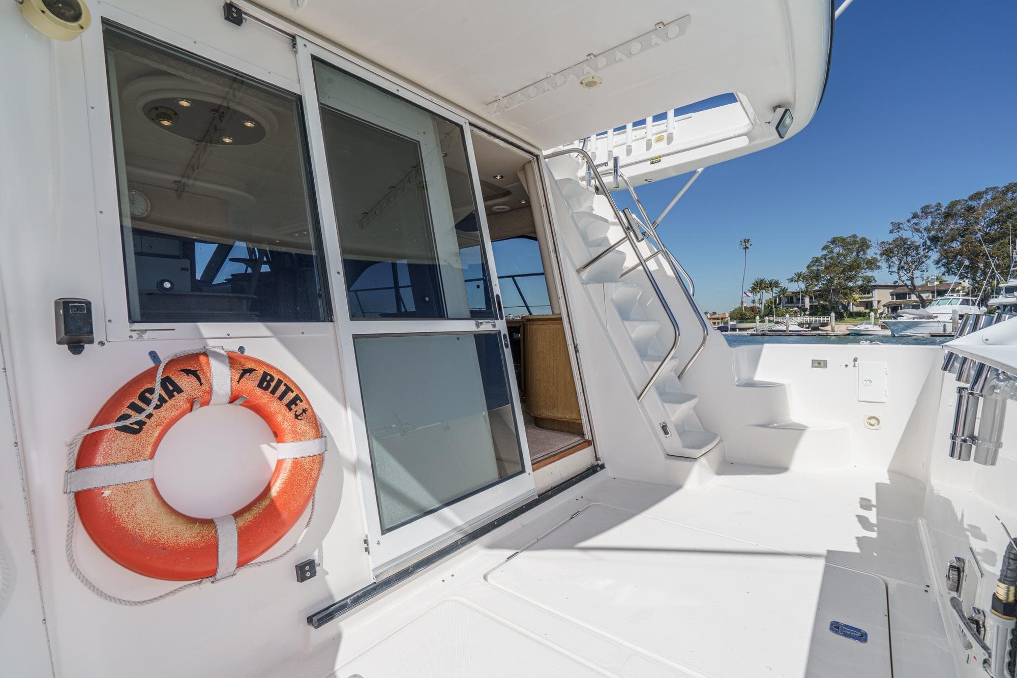 2000 Bayliner 5788 Pilot House Motoryacht deck with life preserver and stairs.