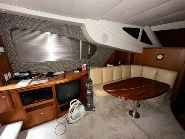 Interior of a 2002 Silverton 39 Motor Yacht with seating area and TV.