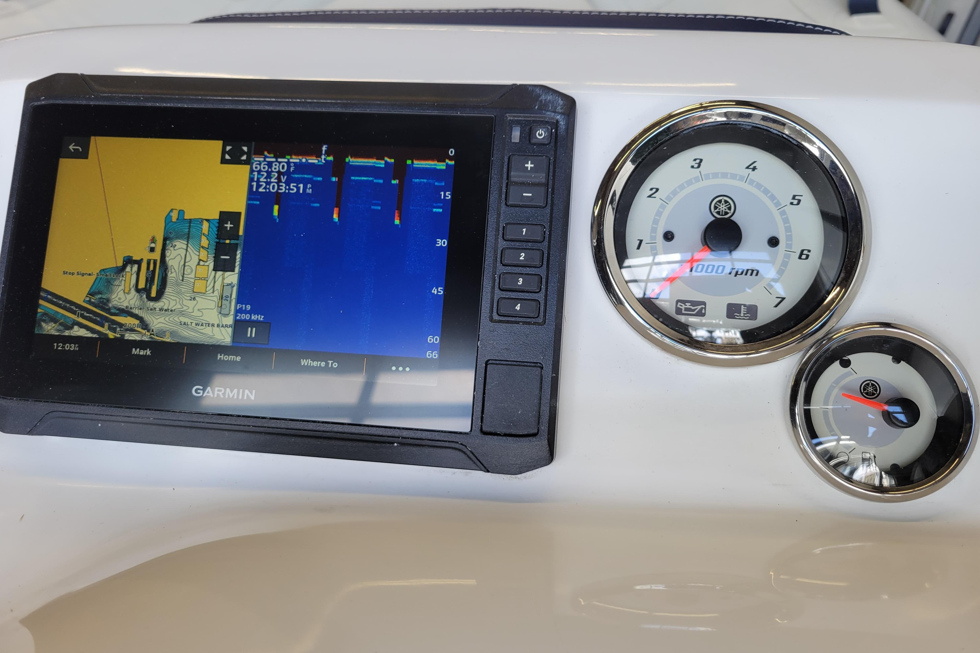 Garmin navigation display and gauges on 2024 Walker Bay Generation 400 DLX boat dashboard.