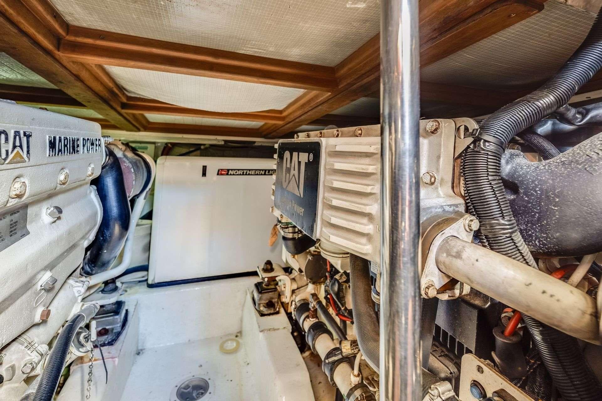 Engine room of a 2004 Riviera Convertible with CAT Marine Power and Northern Lights generator.