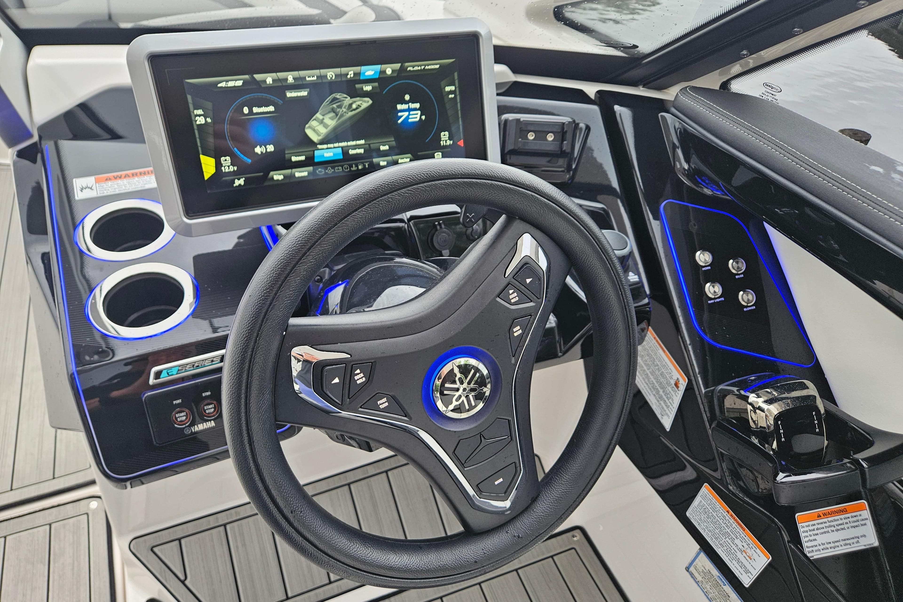 2023 Yamaha Boats 275SDX dashboard with steering wheel and digital display.