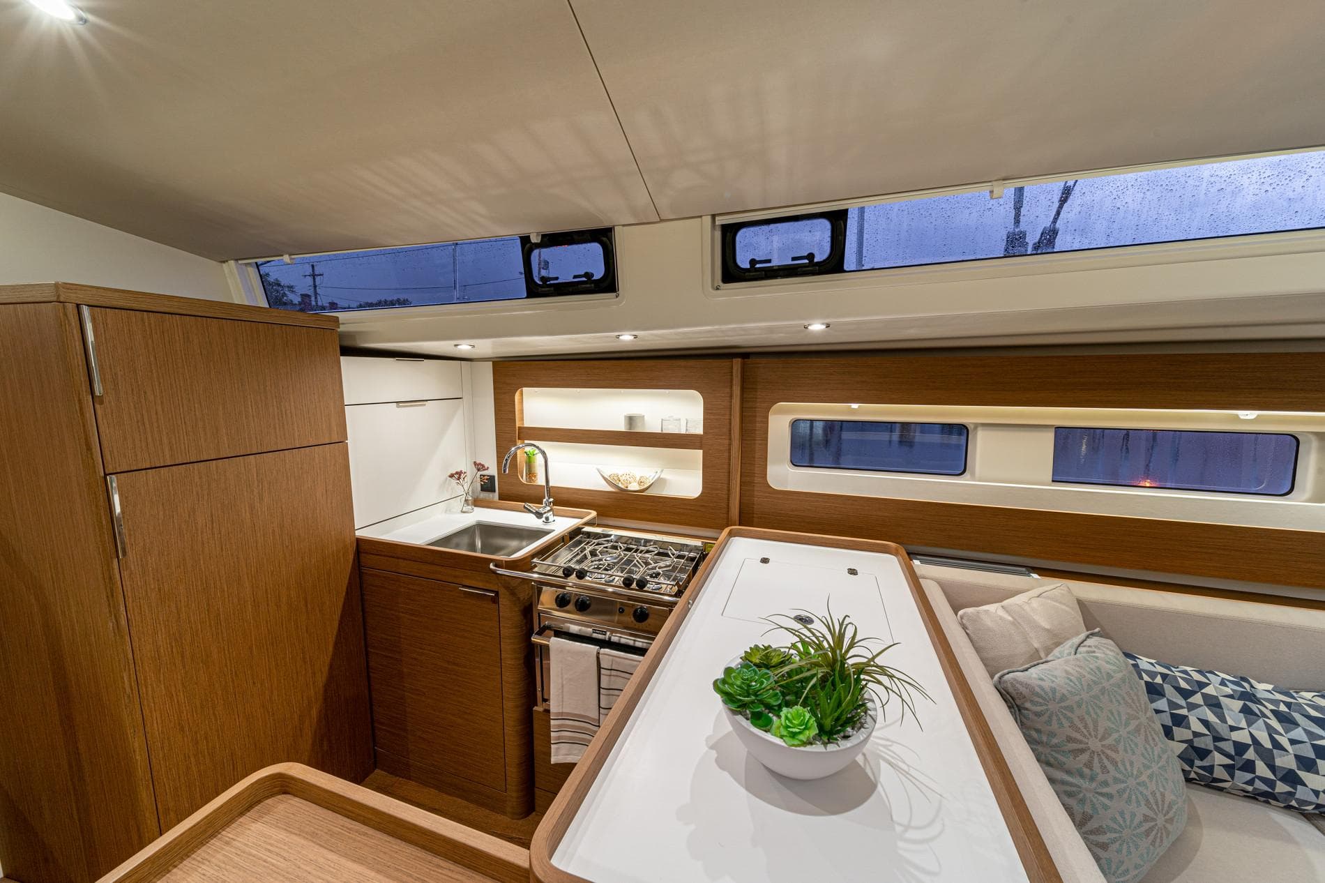 Modern kitchen and dining area in 2025 Beneteau Oceanis Yacht 54.