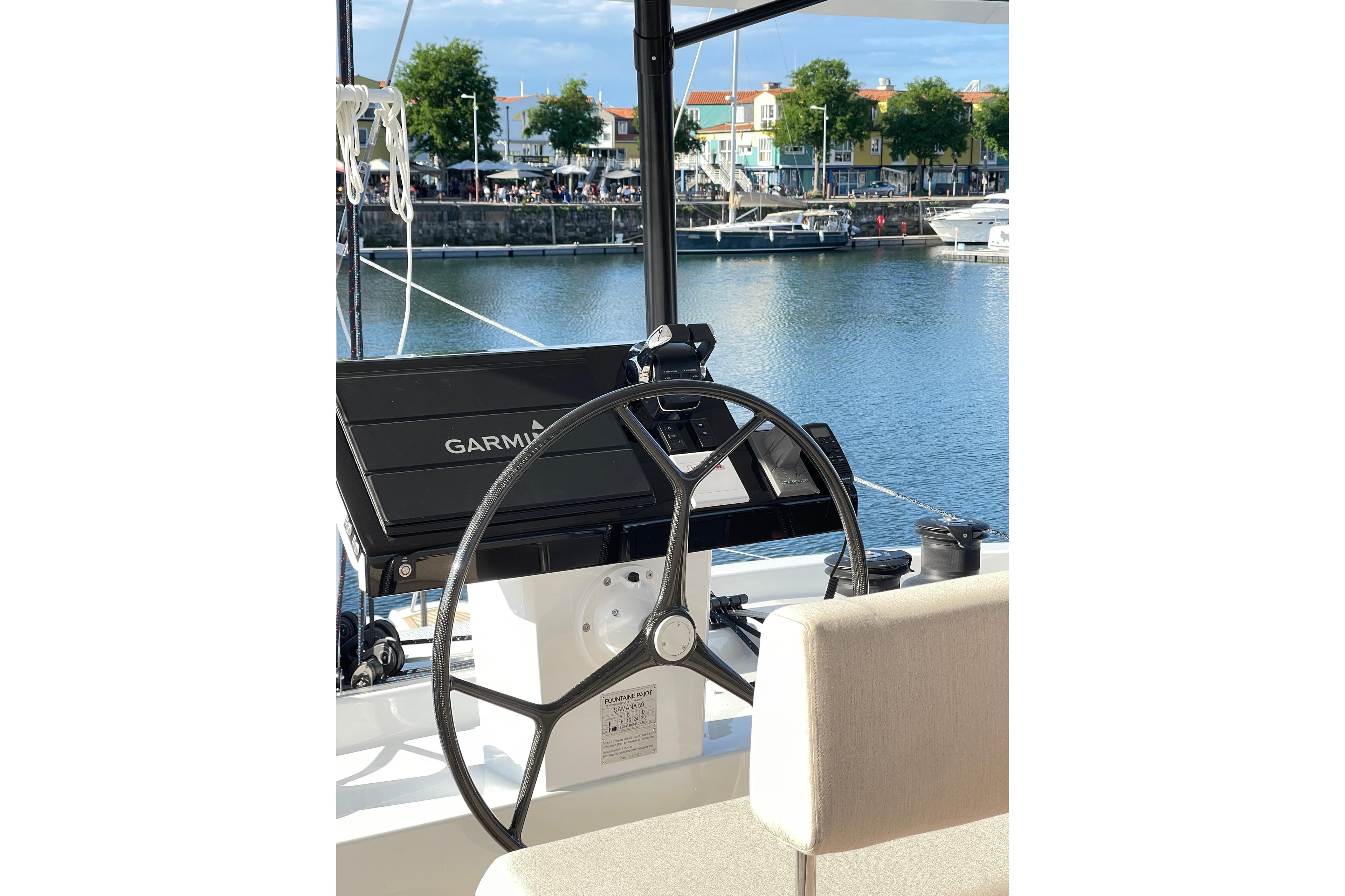 Helm of 2023 Fountaine Pajot Samana 59 catamaran with Garmin navigation system.