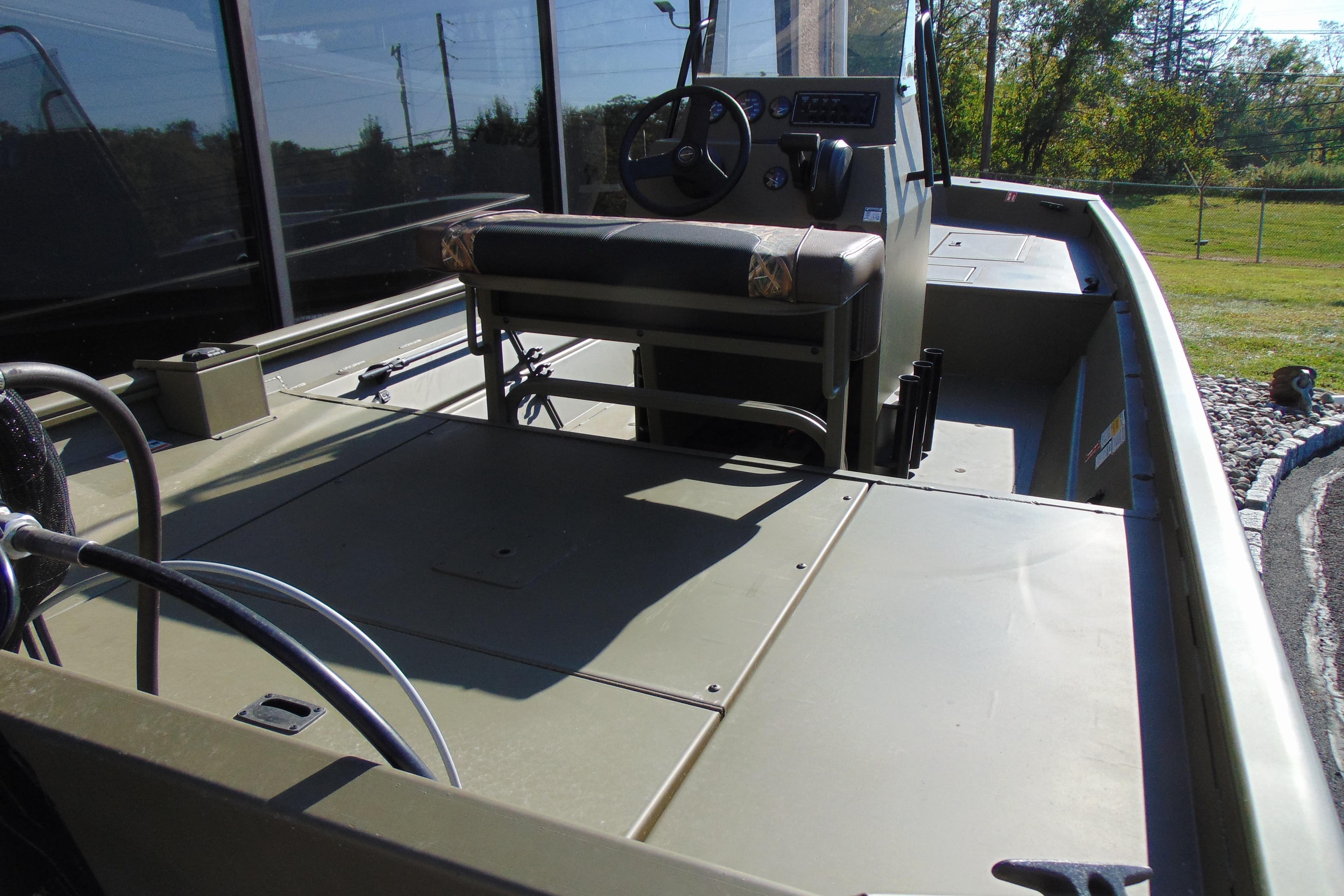 2026 Crestliner 1860 Retriever CC boat interior with steering console and seating.