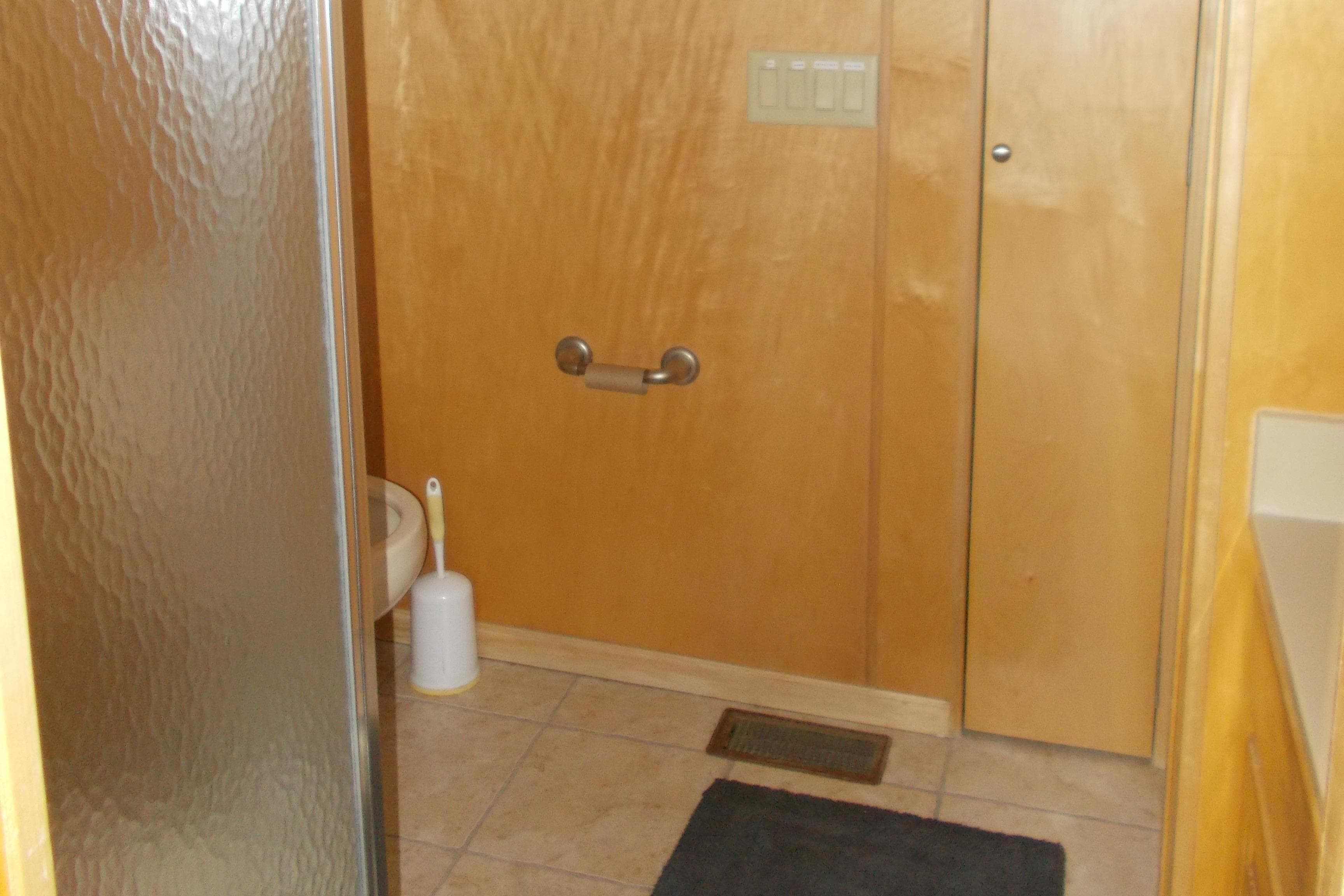 Bathroom in 2005 Stardust Cruisers Summer Obsession Trip 36 houseboat with shower and toilet.
