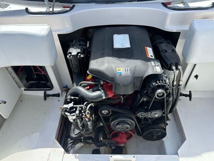 Engine compartment of a 2004 Four Winns 200 Horizon boat, showcasing detailed components.