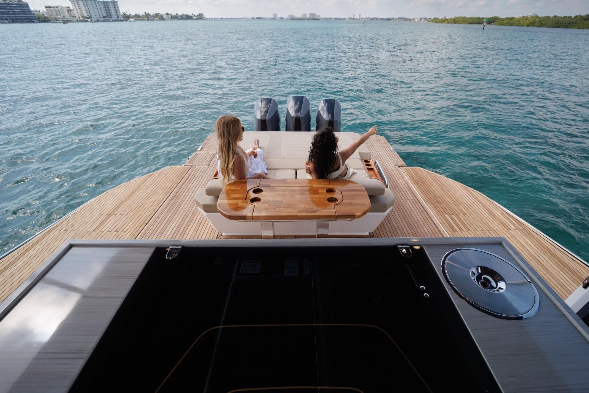 Two people relaxing on a Hanover 447 yacht, 2026 model, enjoying the ocean view.