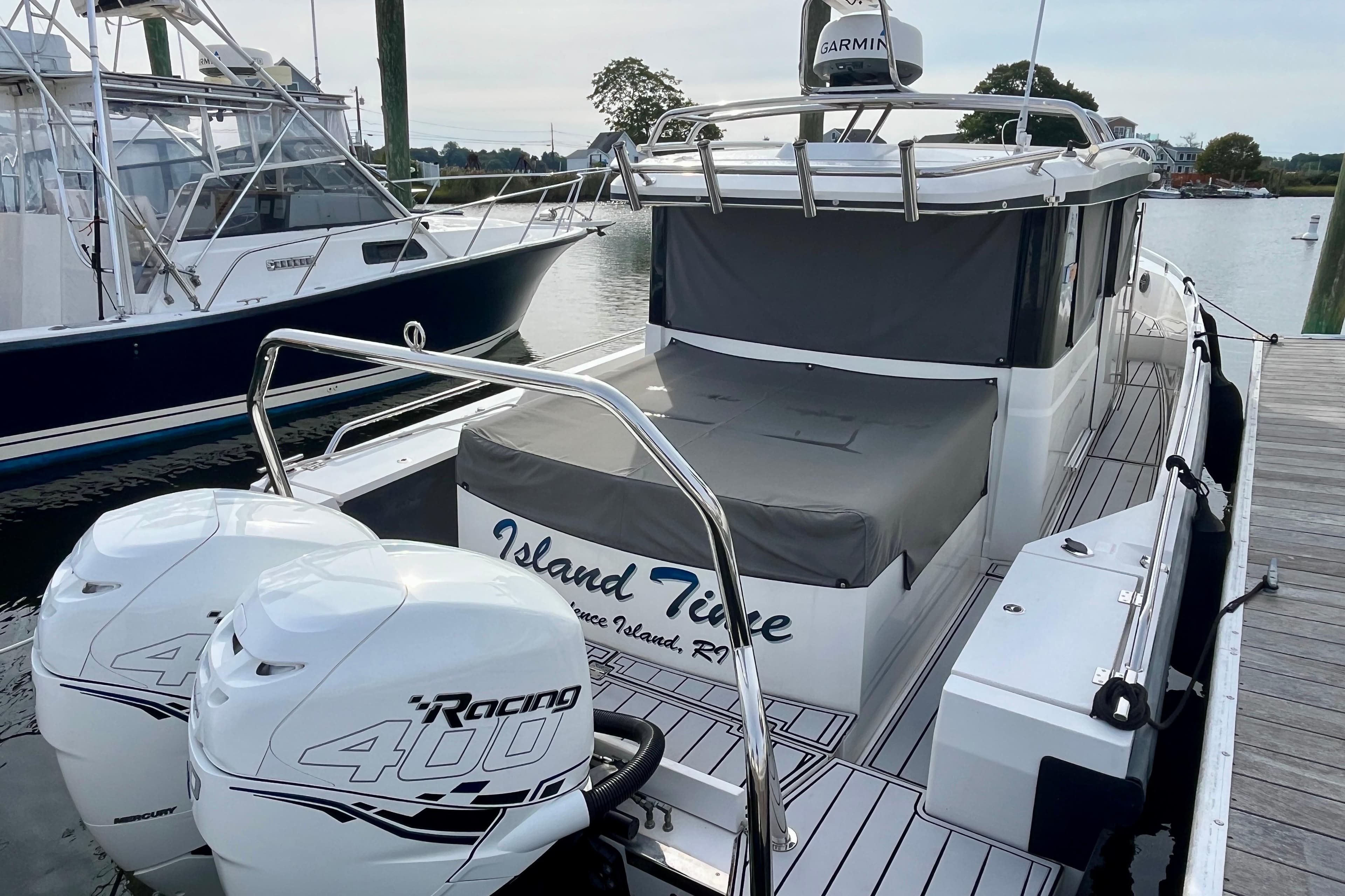 2018 Axopar 37 Sport Cabin R docked, featuring twin Mercury Racing 400 engines.