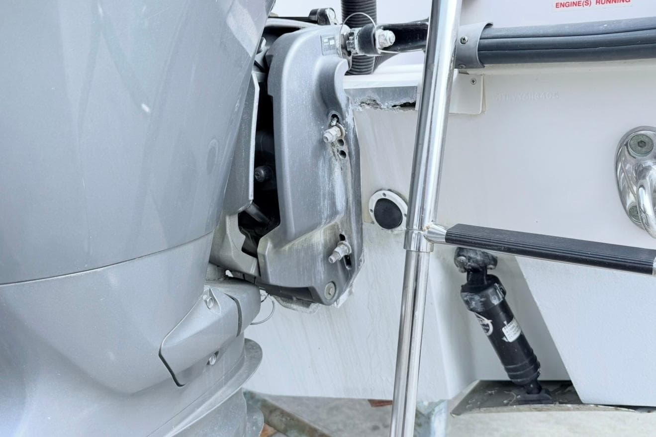 2005 Grady-White Journey 258 boat engine and ladder detail.