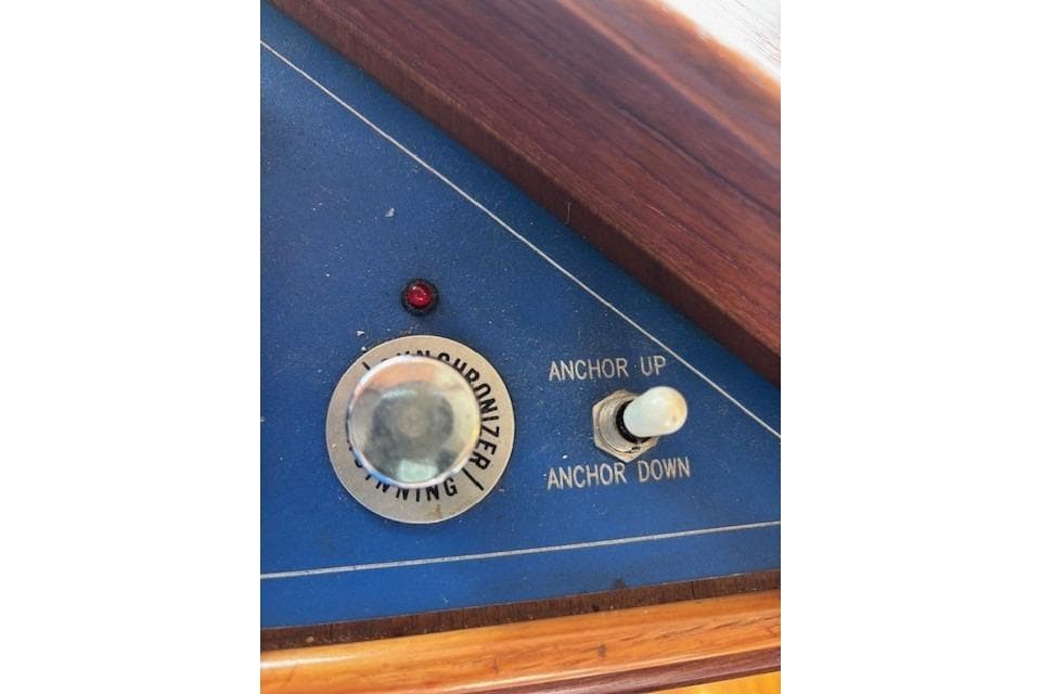 Control panel of a 1983 Canoe Cove Sedan Bridge with anchor switch.