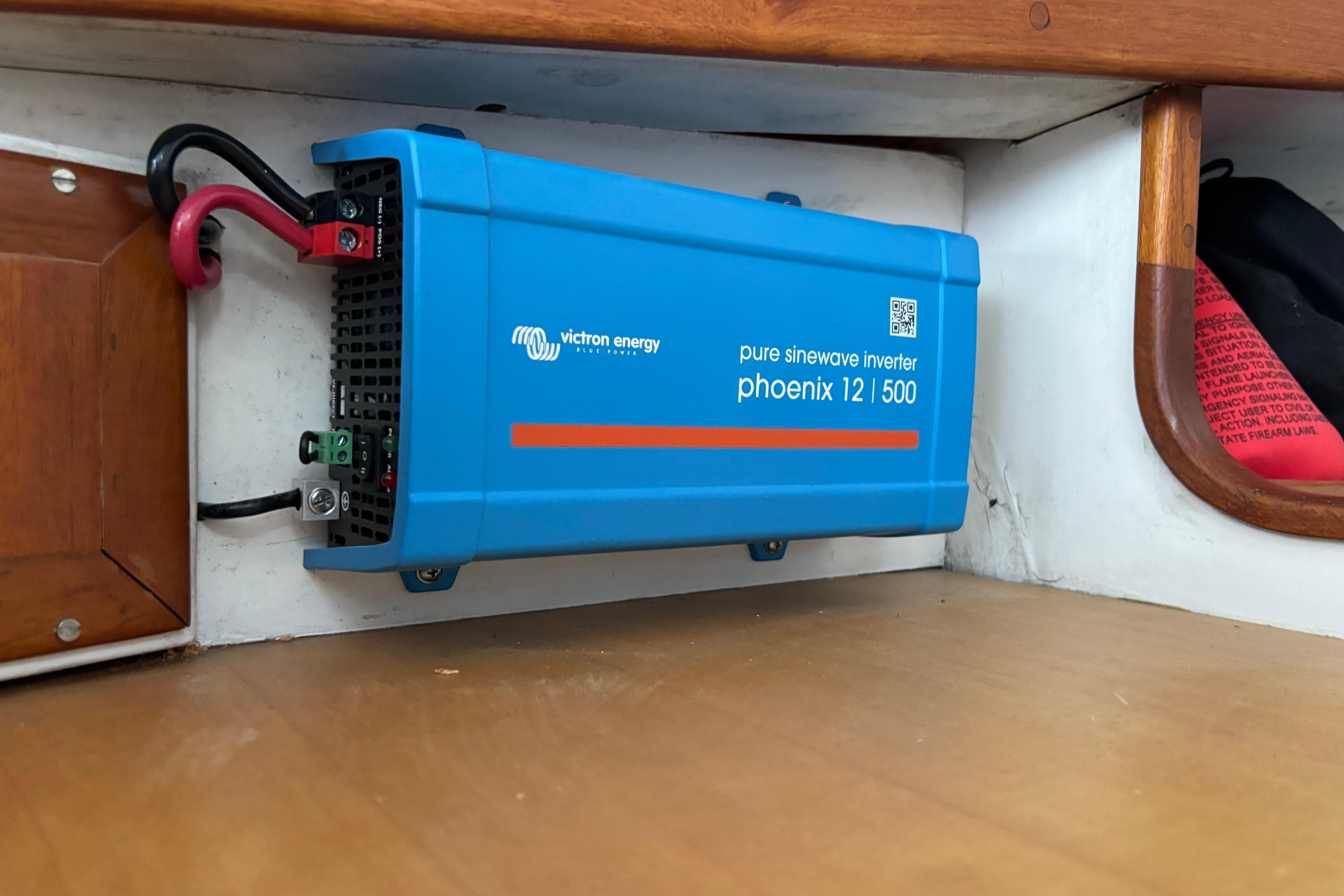 Blue Victron Energy inverter installed on a Jarvis Newman 36 boat, model year 1985.