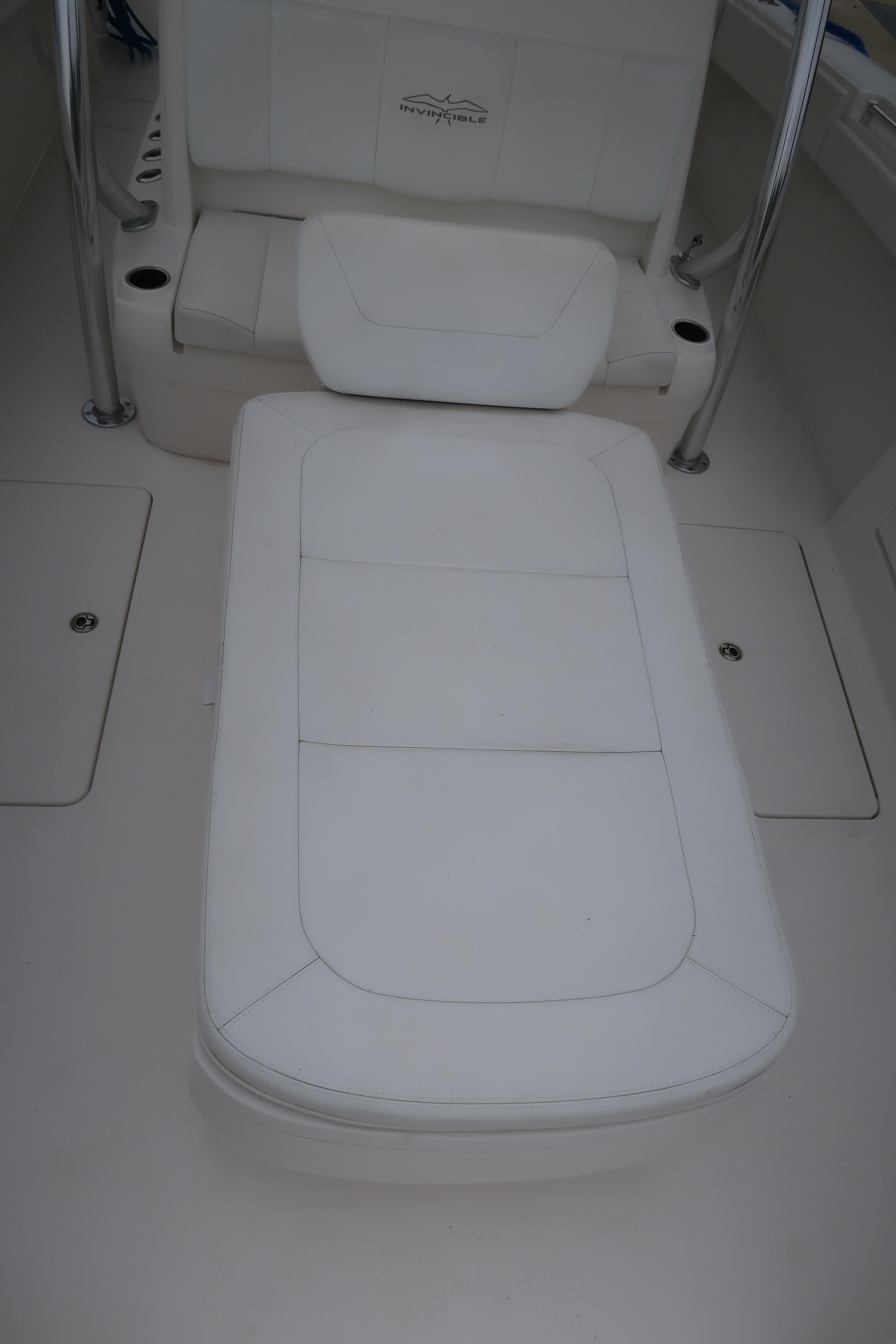 2016 Invincible 42 Open Fisherman boat with white cushioned seating.