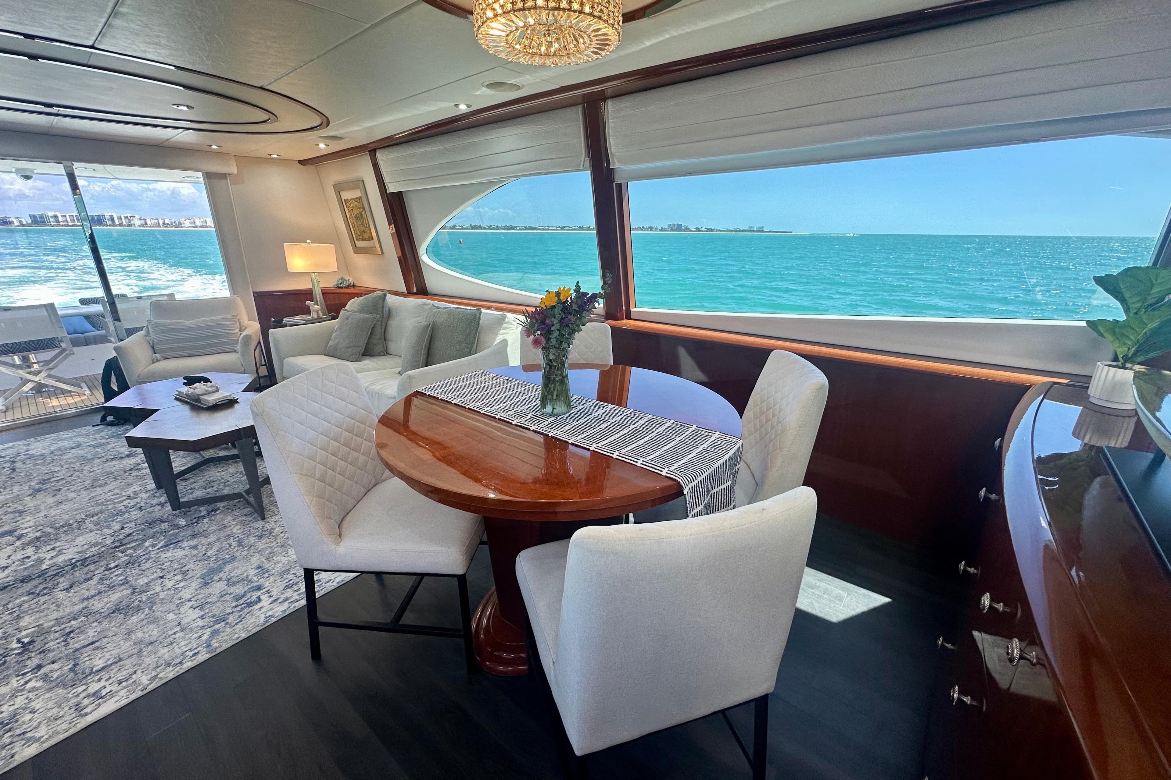 Luxurious interior of 2006 Lazzara 68 Motoryacht with ocean view and elegant furnishings.