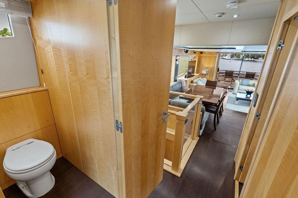 Luxurious interior of 2012 Sunseeker 88 Yacht with wooden finishes and elegant furnishings.