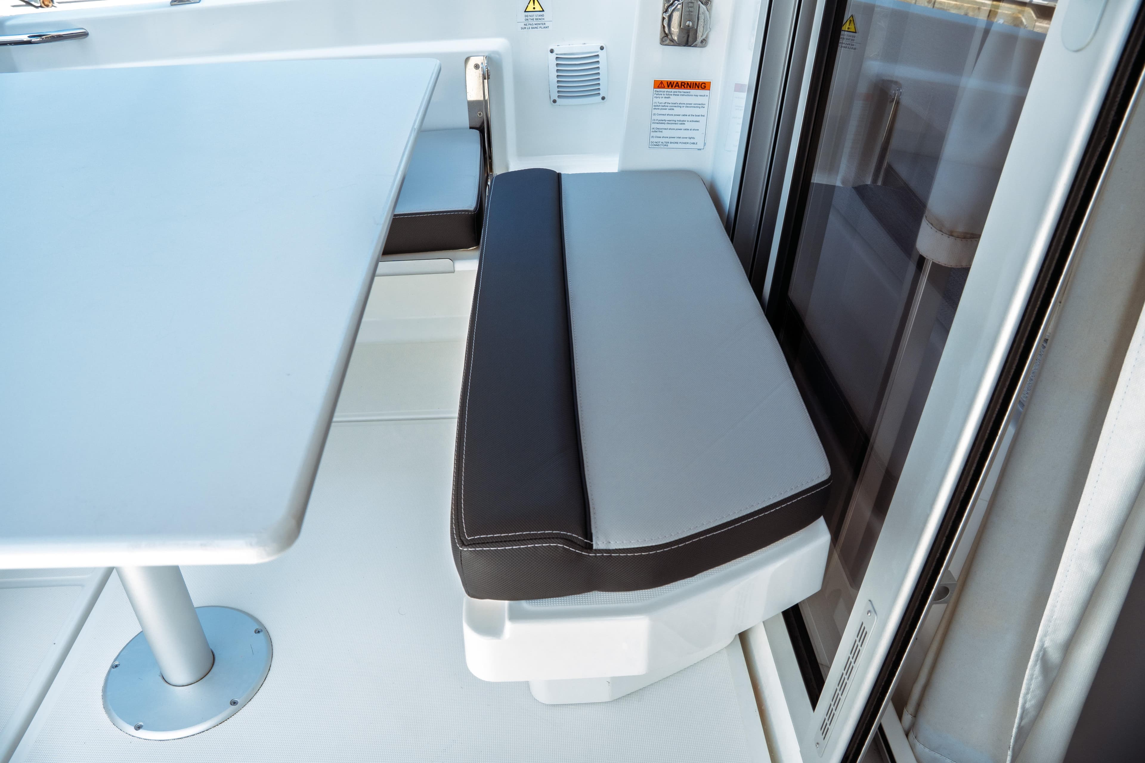 2023 Jeanneau NC Weekender 795 Series 2 interior seating and table detail.
