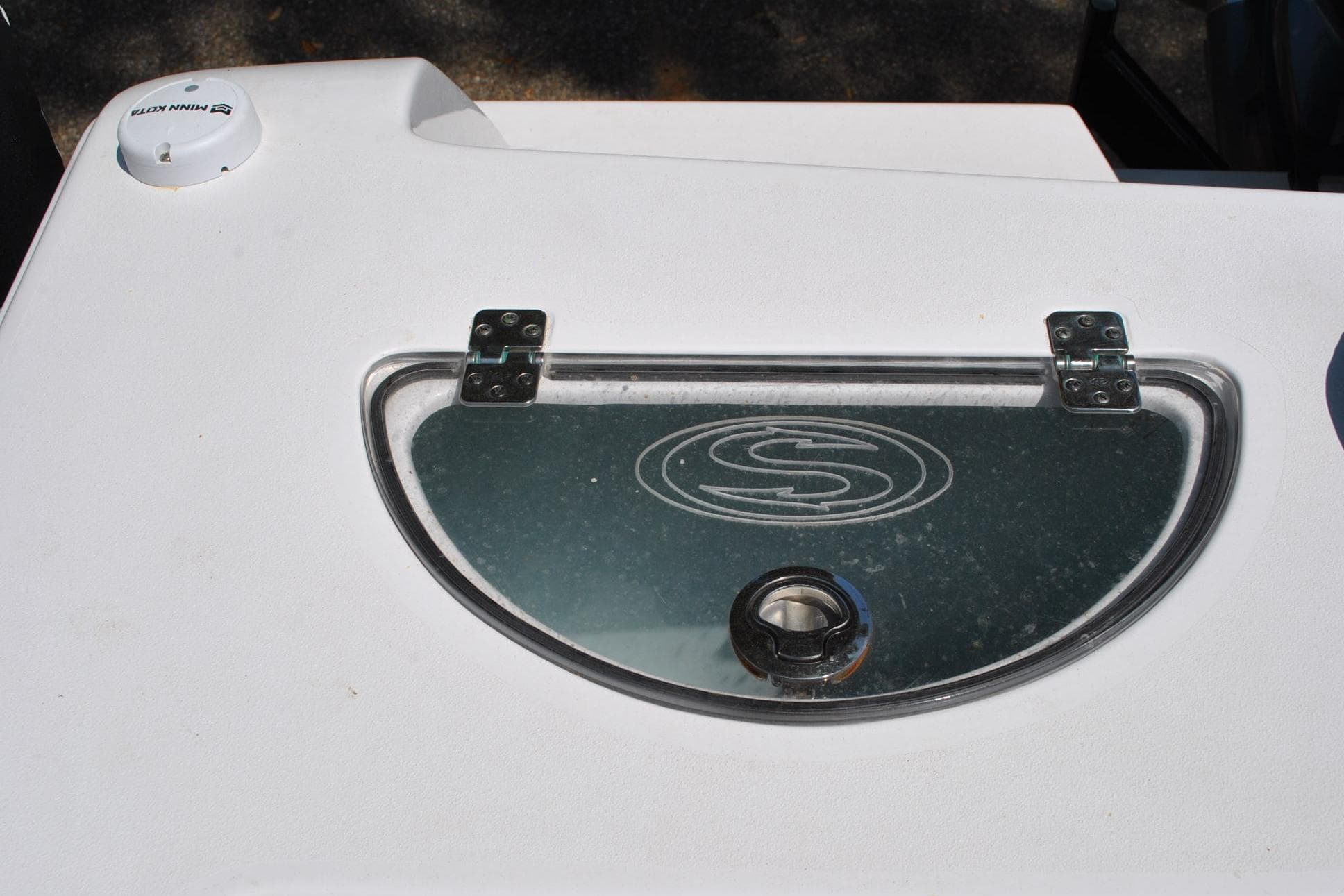 2020 Sportsman Open 232 Center Console boat detail with logo and hatch.