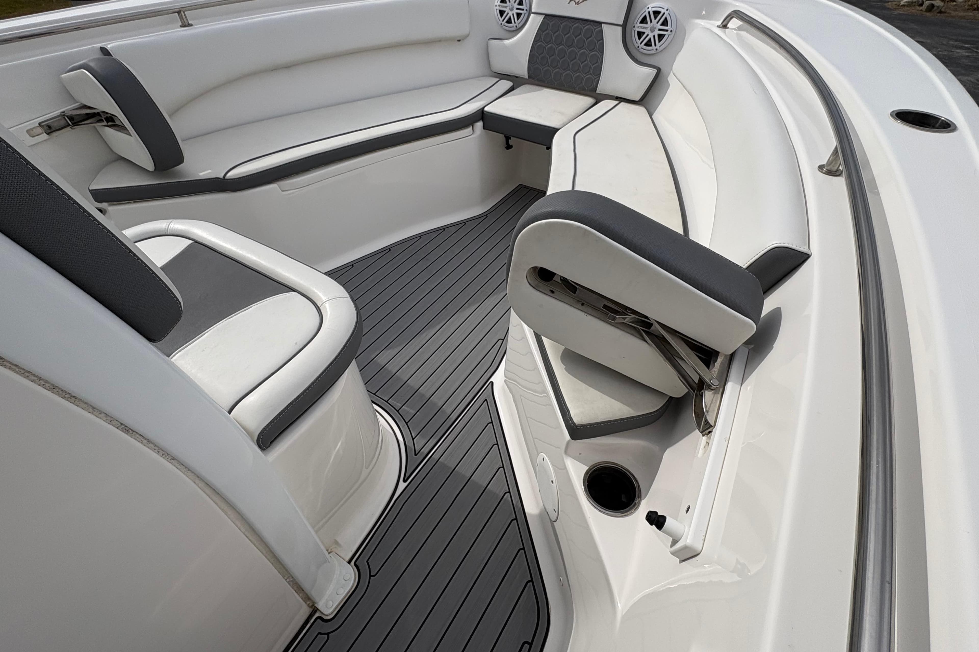 2019 Tidewater 232 CC Adventure boat interior with gray and white seating and flooring.
