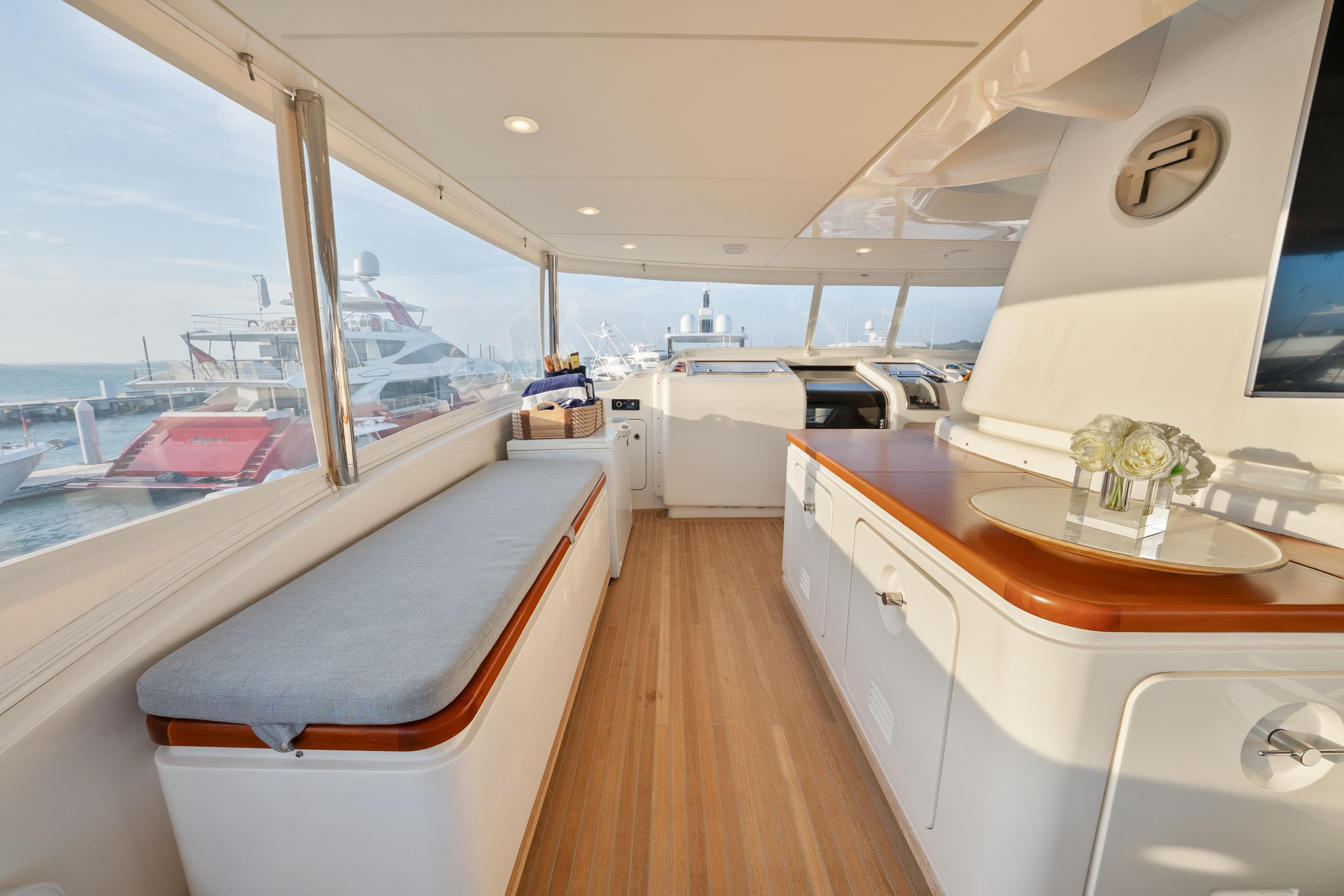 Luxurious interior of 2012 Sanlorenzo SD92 yacht with elegant seating and panoramic windows.