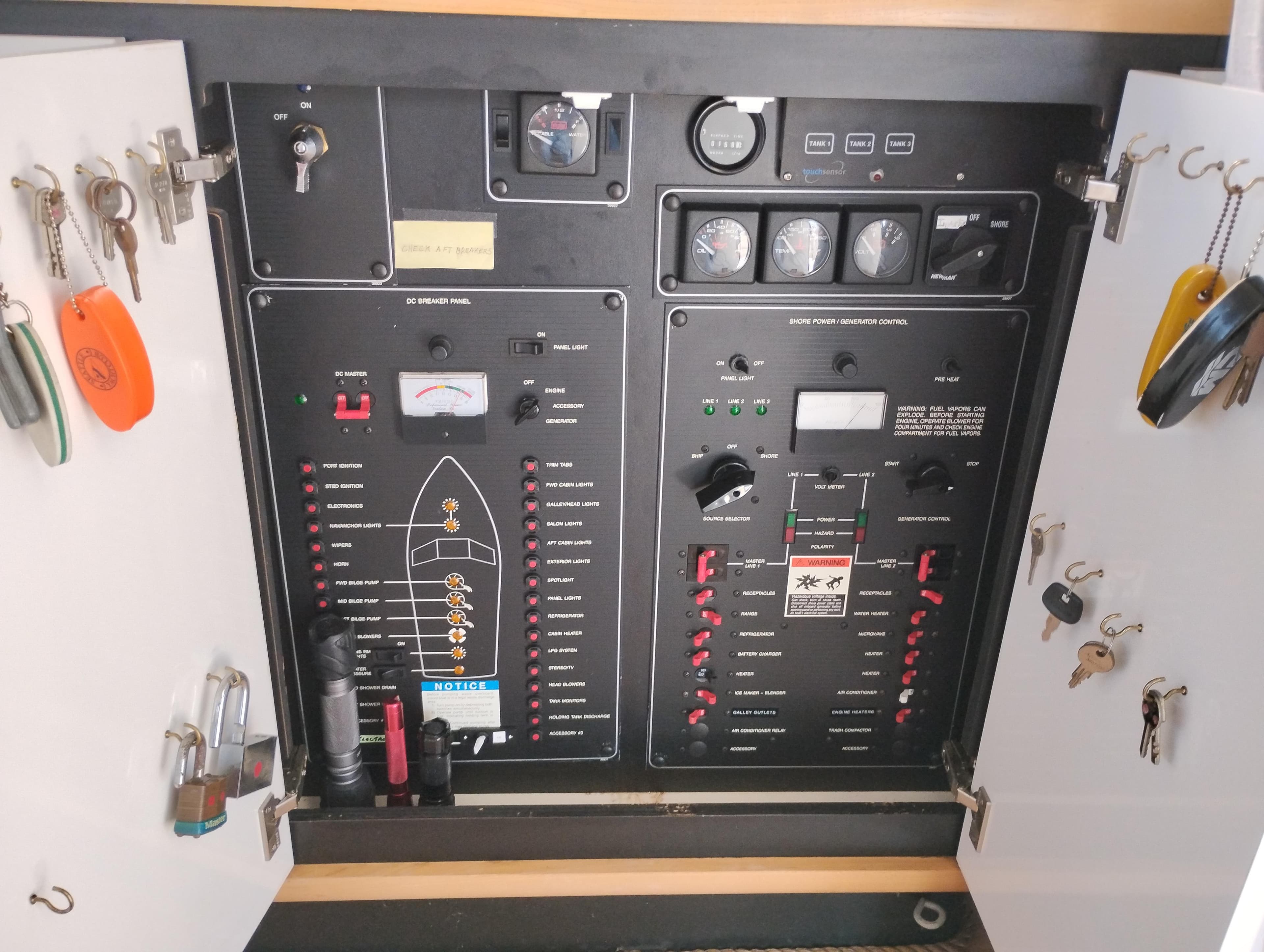 Electrical control panel of a 1992 Bayliner 4388 Motoryacht with keys and switches.